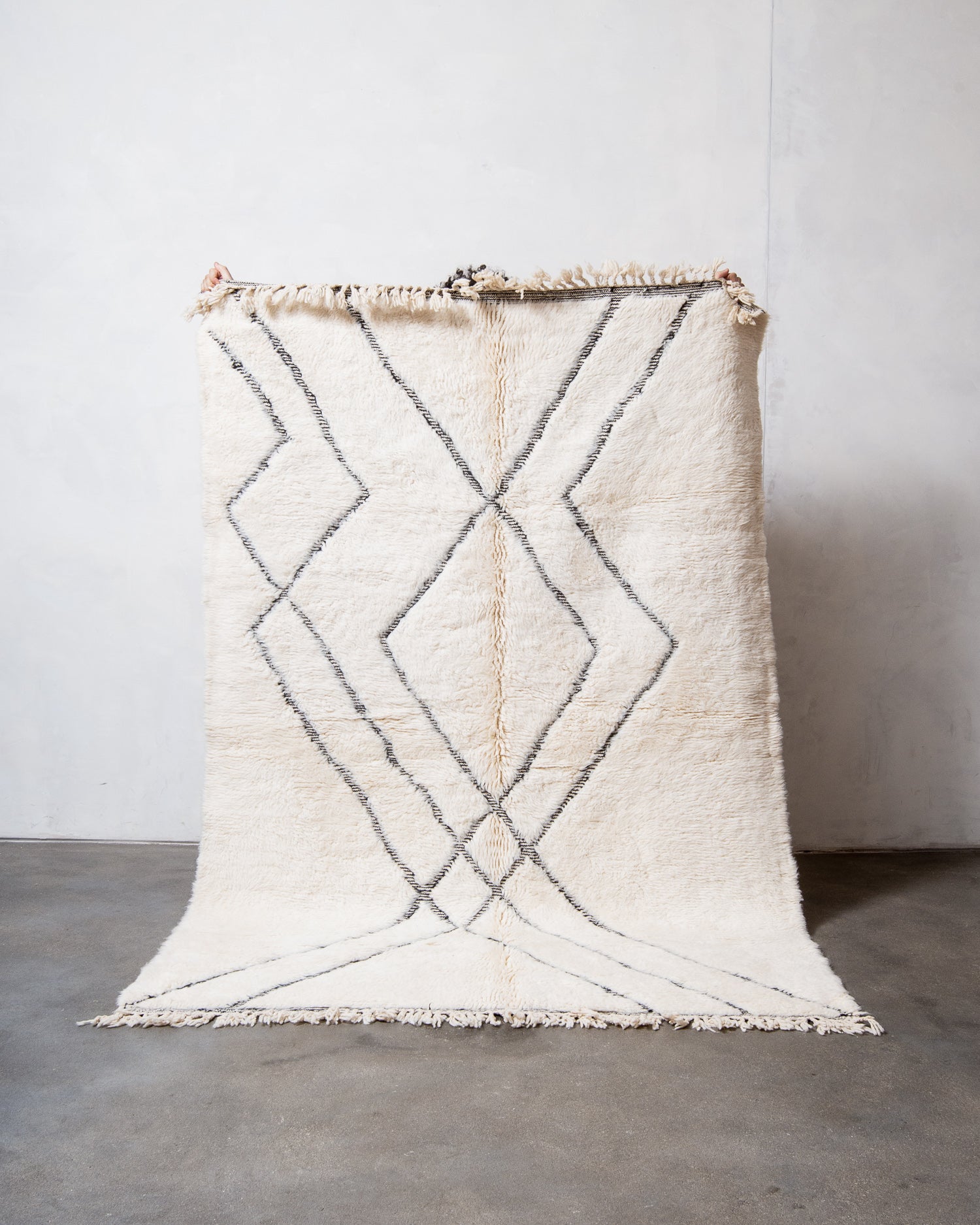 Modern, designer, handcrafted Berber rug from Morocco. Beniourain carpet with minimalist design, natural wool pile and a fluffy texture.