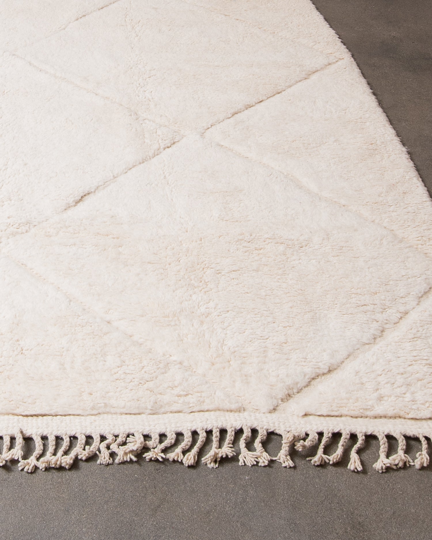 Modern, designer, handcrafted Berber rug from Morocco. Beniourain carpet with minimalist design, natural wool pile and a fluffy texture.