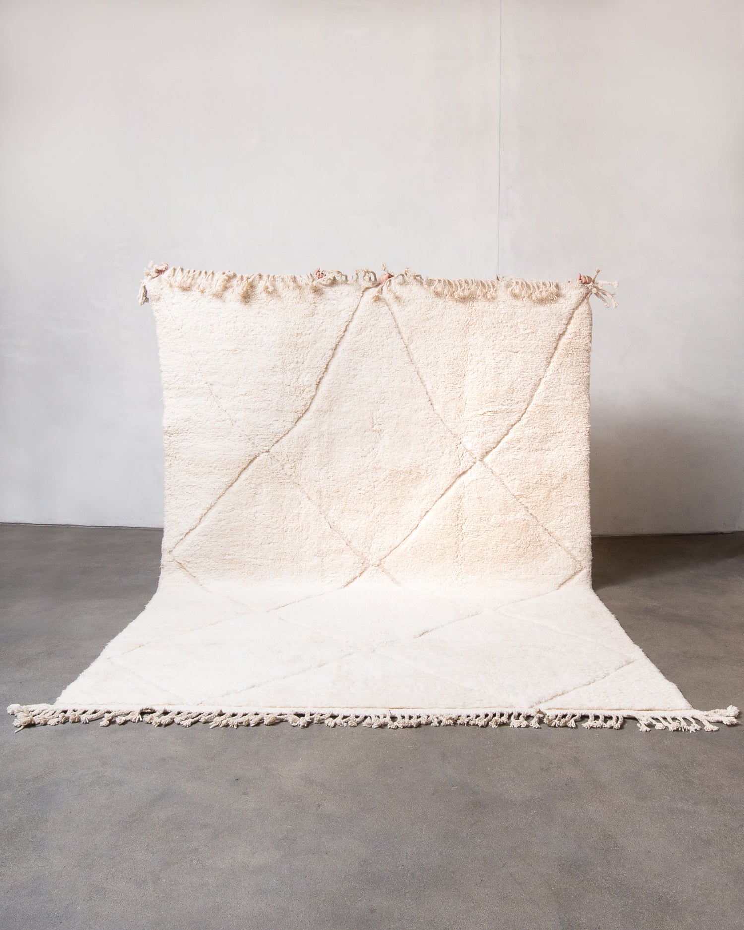 Modern, designer, handcrafted Berber rug from Morocco. Beniourain carpet with minimalist design, natural wool pile and a fluffy texture.