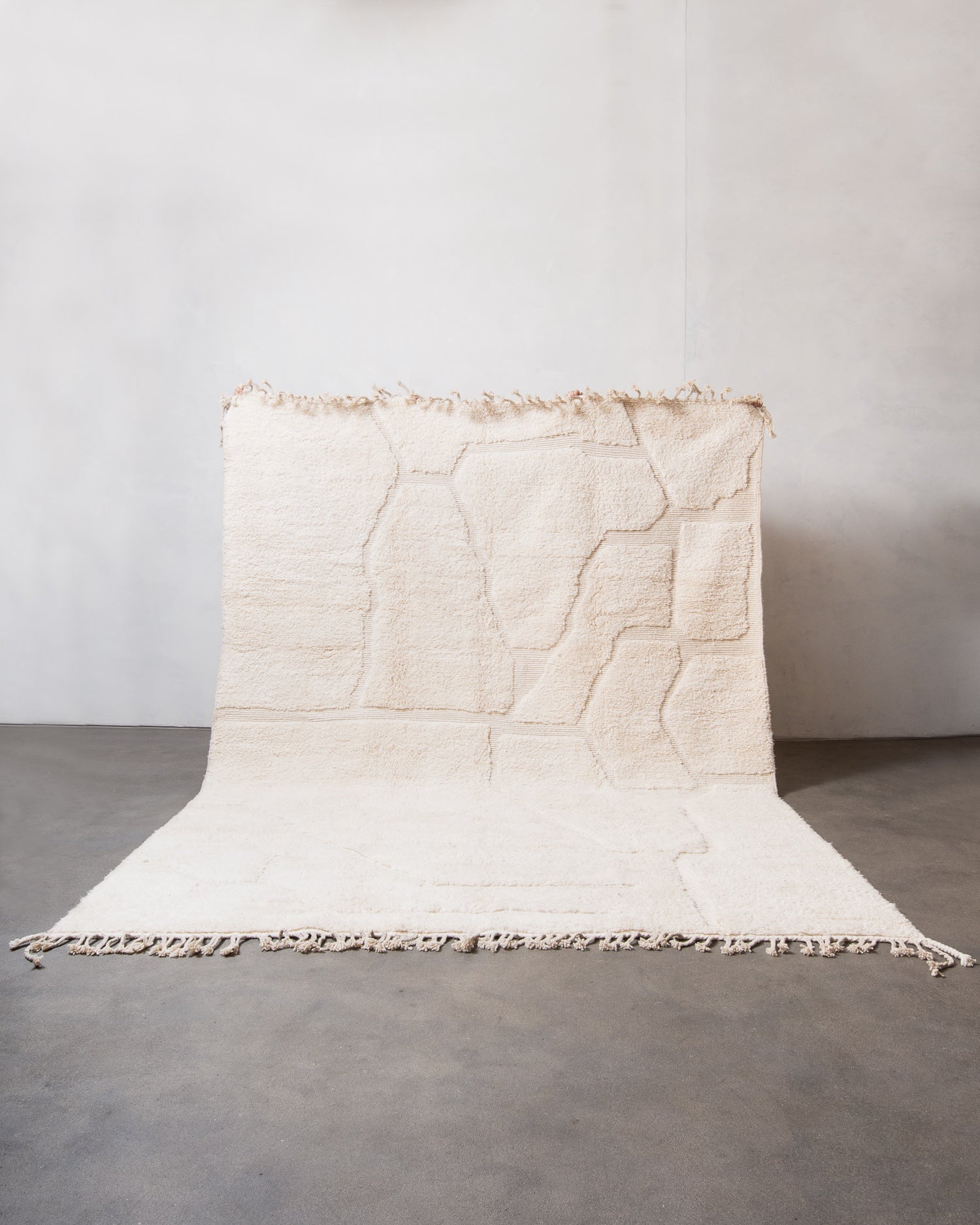 Modern, designer, handcrafted Berber rug from Morocco. Beniourain carpet with minimalist design, natural wool pile and a fluffy texture.