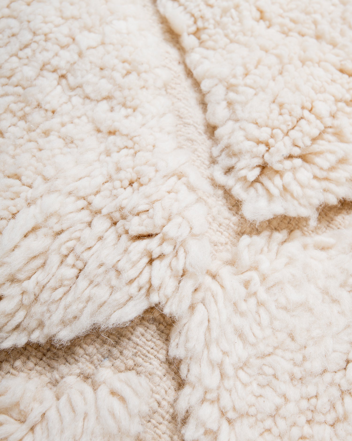 Modern, designer, handcrafted Berber rug from Morocco. Beniourain carpet with minimalist design, natural wool pile and a fluffy texture.