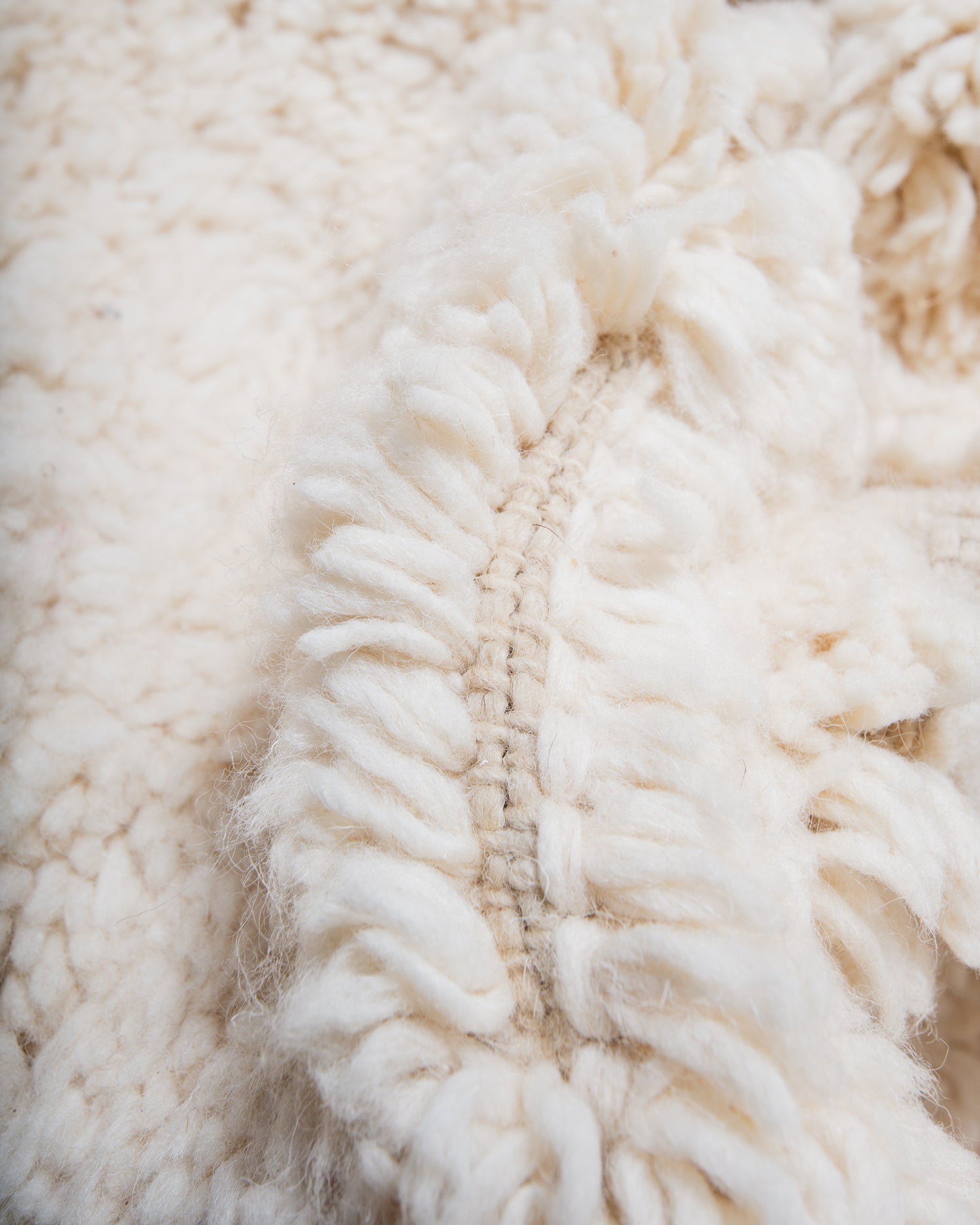 Modern, designer, handcrafted Berber rug from Morocco. Beniourain carpet with minimalist design, natural wool pile and a fluffy texture.