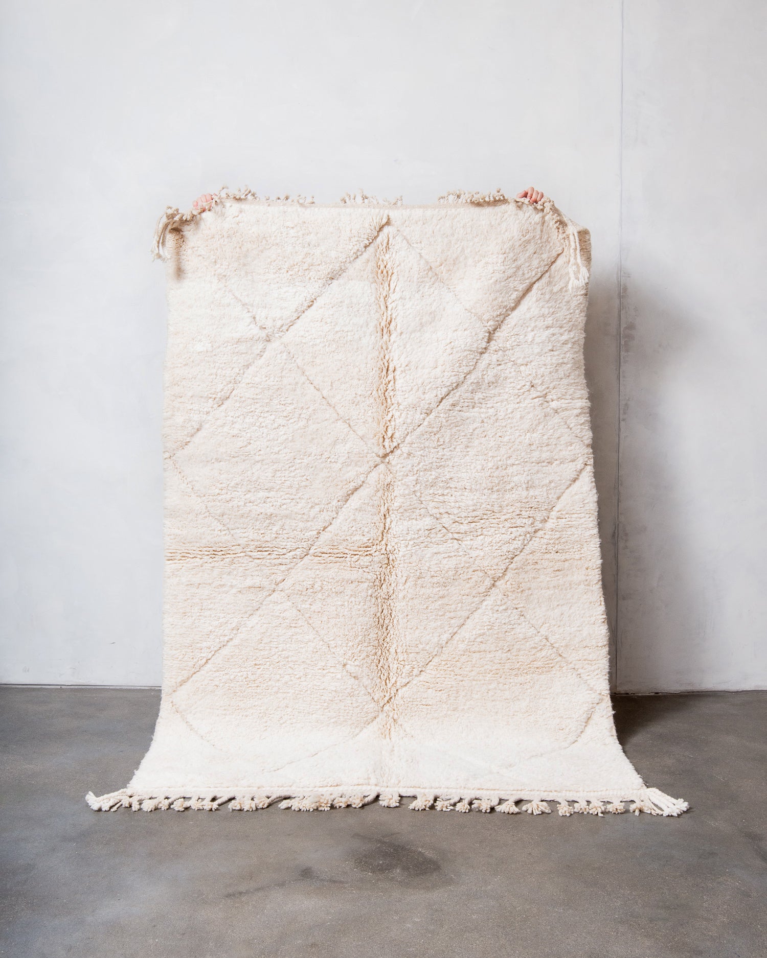 Modern, designer, handcrafted Berber rug from Morocco. Beniourain carpet with minimalist design, natural wool pile and a fluffy texture.