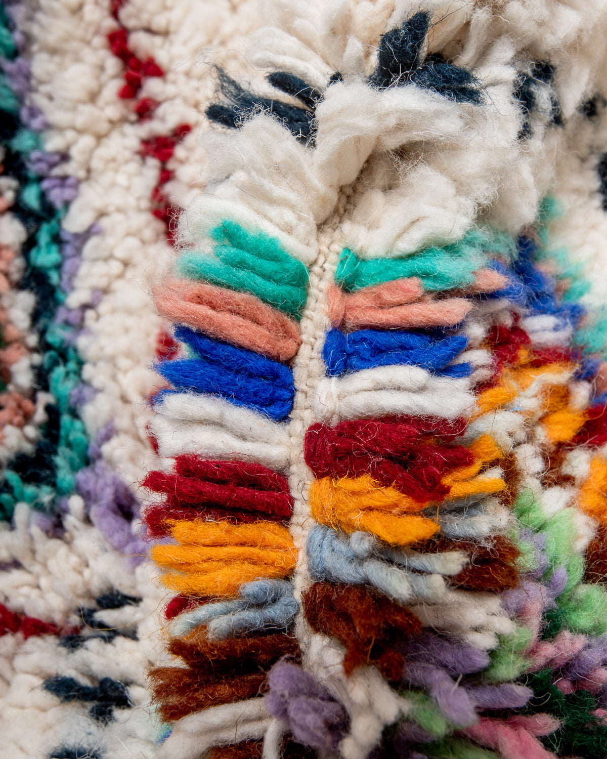 Modern, designer, handcrafted Berber rug from Morocco. Beniourain carpet with beautiful colours and patterns and fluffy wool texture.