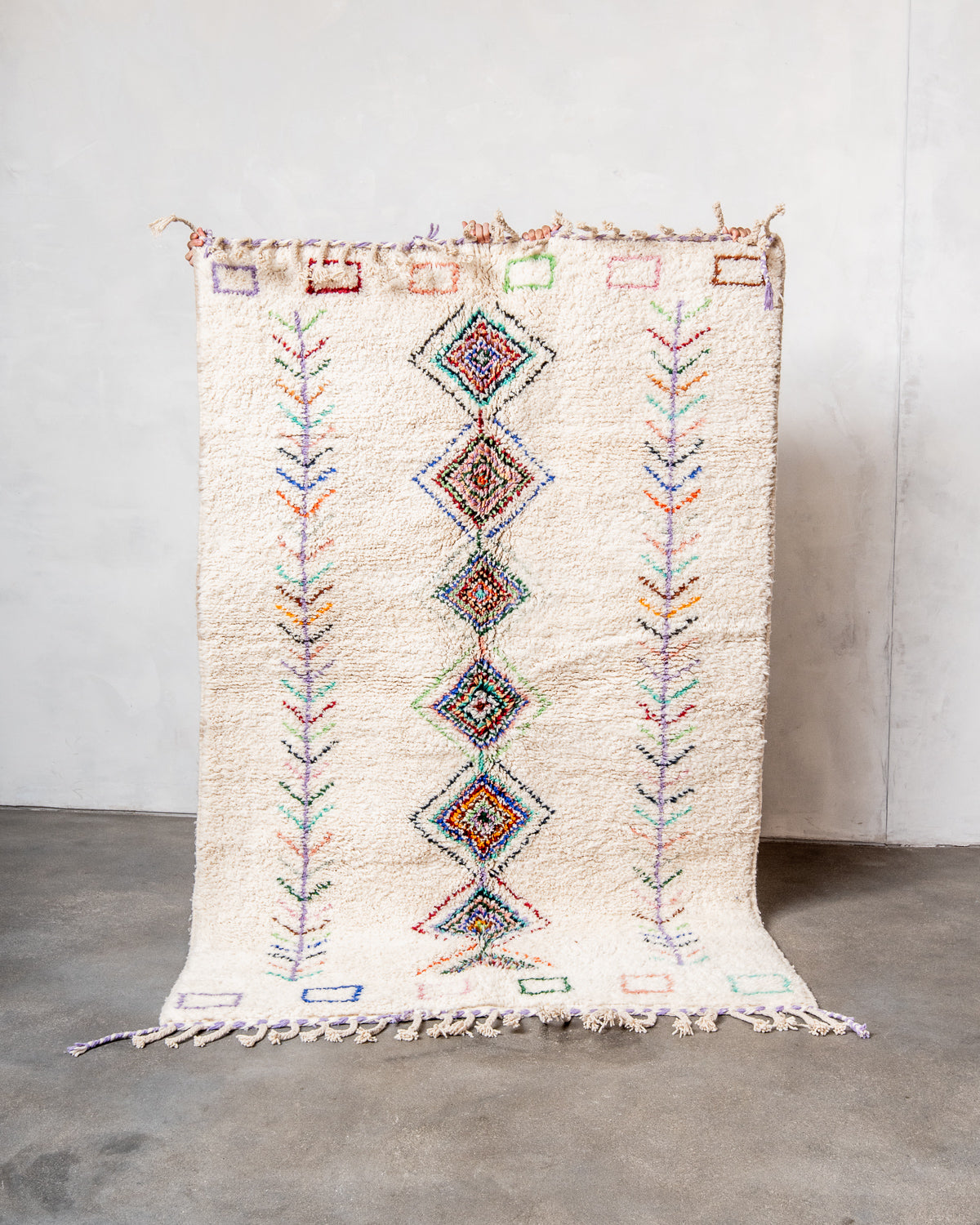 Modern, designer, handcrafted Berber rug from Morocco. Beniourain carpet with beautiful colours and patterns and fluffy wool texture.