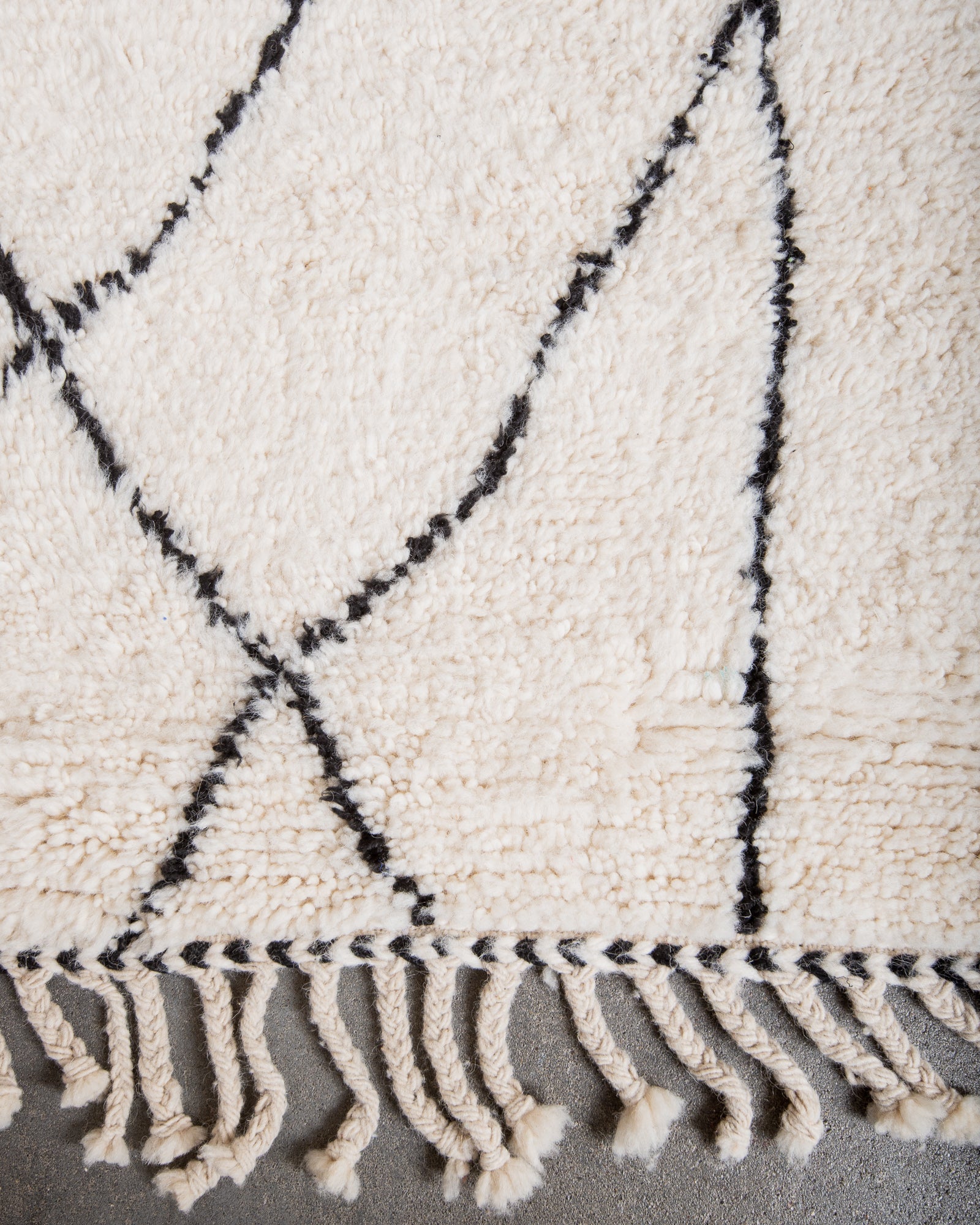 Modern, designer, handcrafted Berber rug from Morocco. Beniourain carpet with minimalist design, natural wool pile and a fluffy texture.