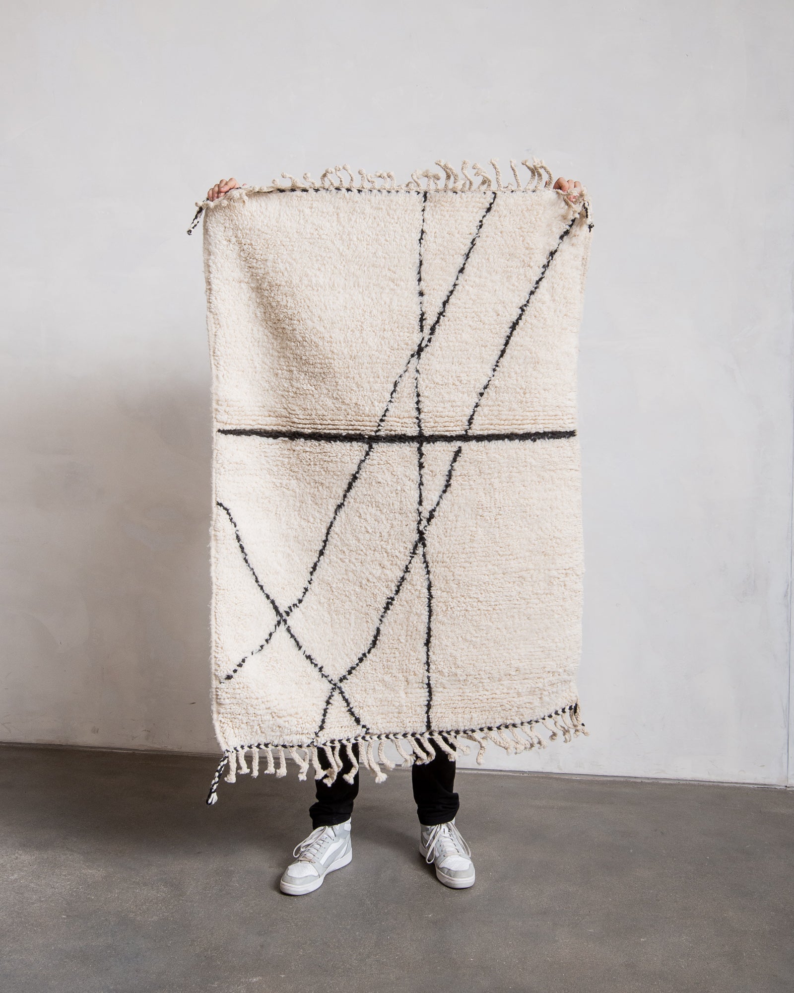 Modern, designer, handcrafted Berber rug from Morocco. Beniourain carpet with minimalist design, natural wool pile and a fluffy texture.