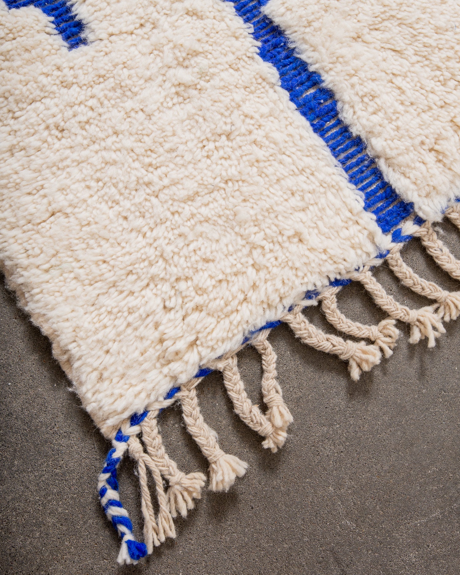 Modern, designer, handcrafted Berber rug from Morocco. Beniourain carpet with minimalist design, natural wool pile and a fluffy texture.