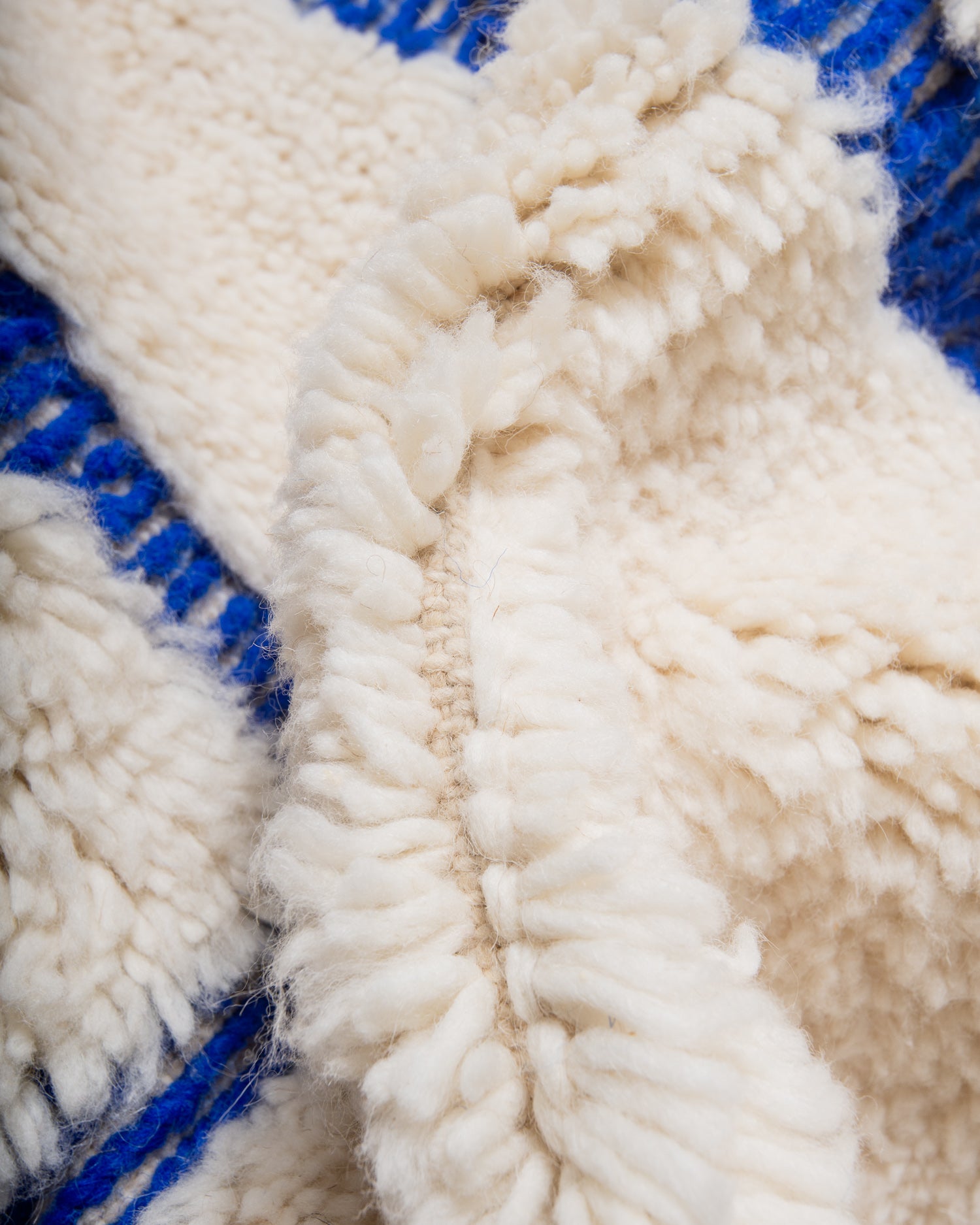 Modern, designer, handcrafted Berber rug from Morocco. Beniourain carpet with minimalist design, natural wool pile and a fluffy texture.