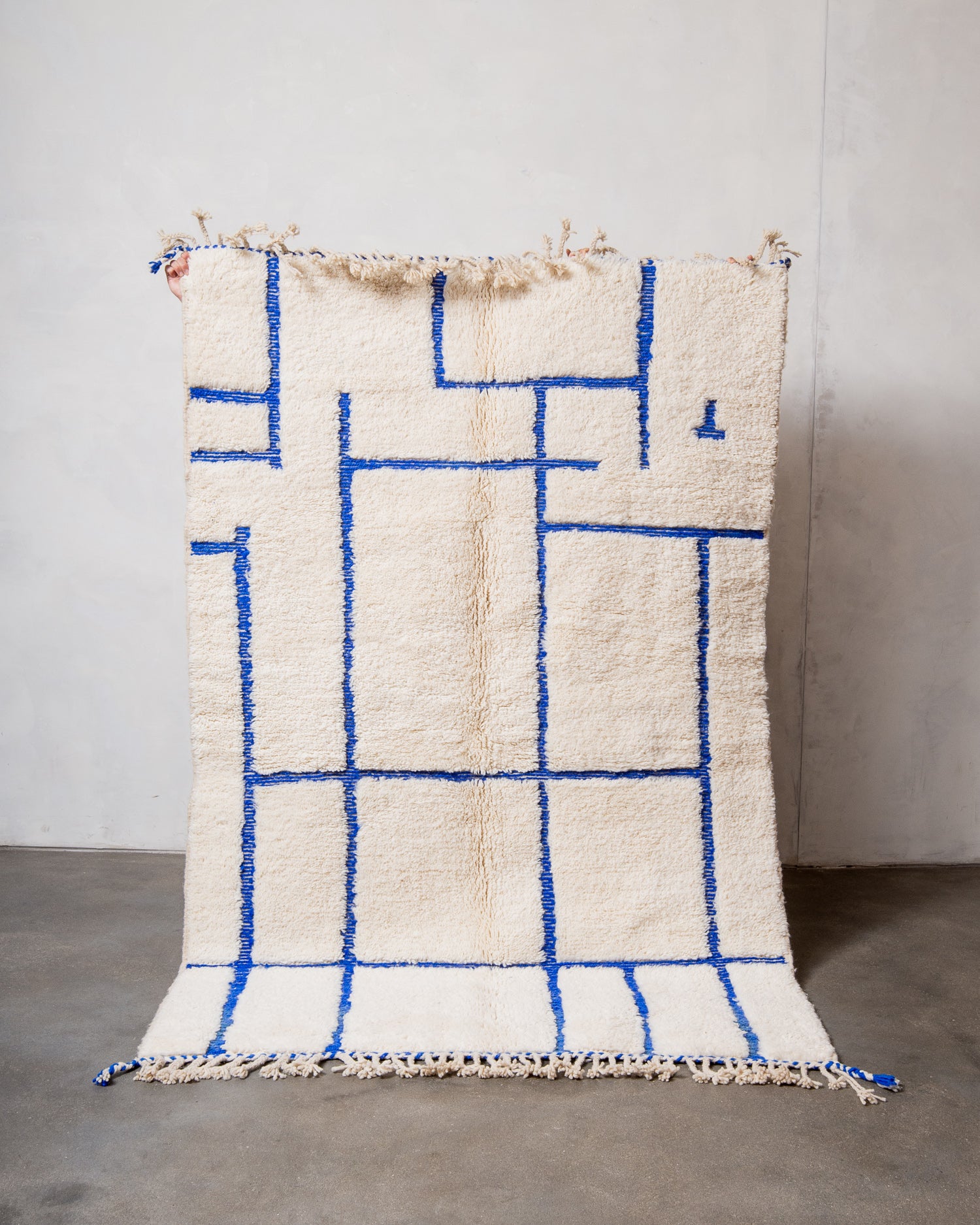 Modern, designer, handcrafted Berber rug from Morocco. Beniourain carpet with minimalist design, natural wool pile and a fluffy texture.