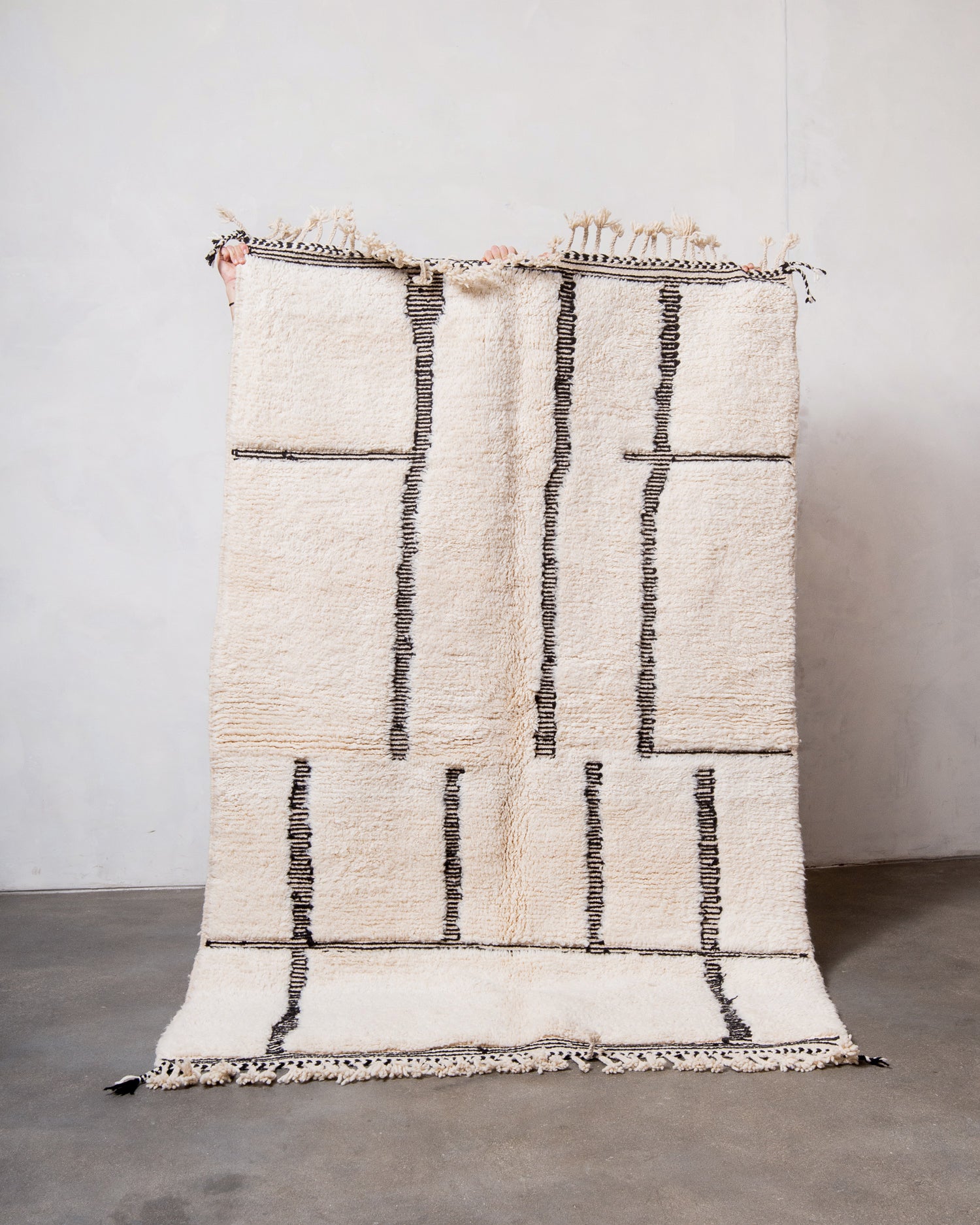 Modern, designer, handcrafted Berber rug from Morocco. Beniourain carpet with minimalist design, natural wool pile and a fluffy texture.
