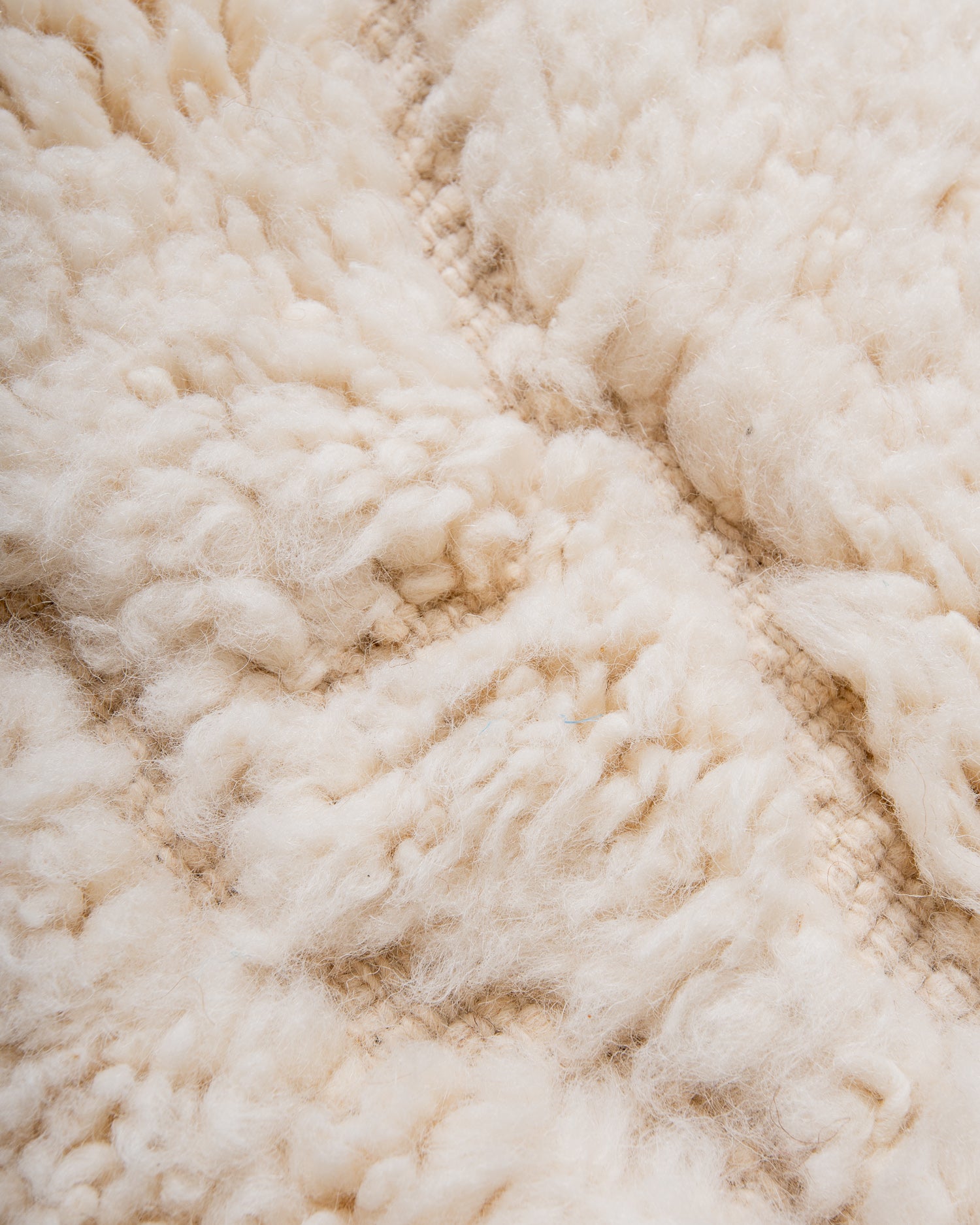 Modern, designer, handcrafted Berber rug from Morocco. Beniourain carpet with minimalist design, natural wool pile and a fluffy texture.