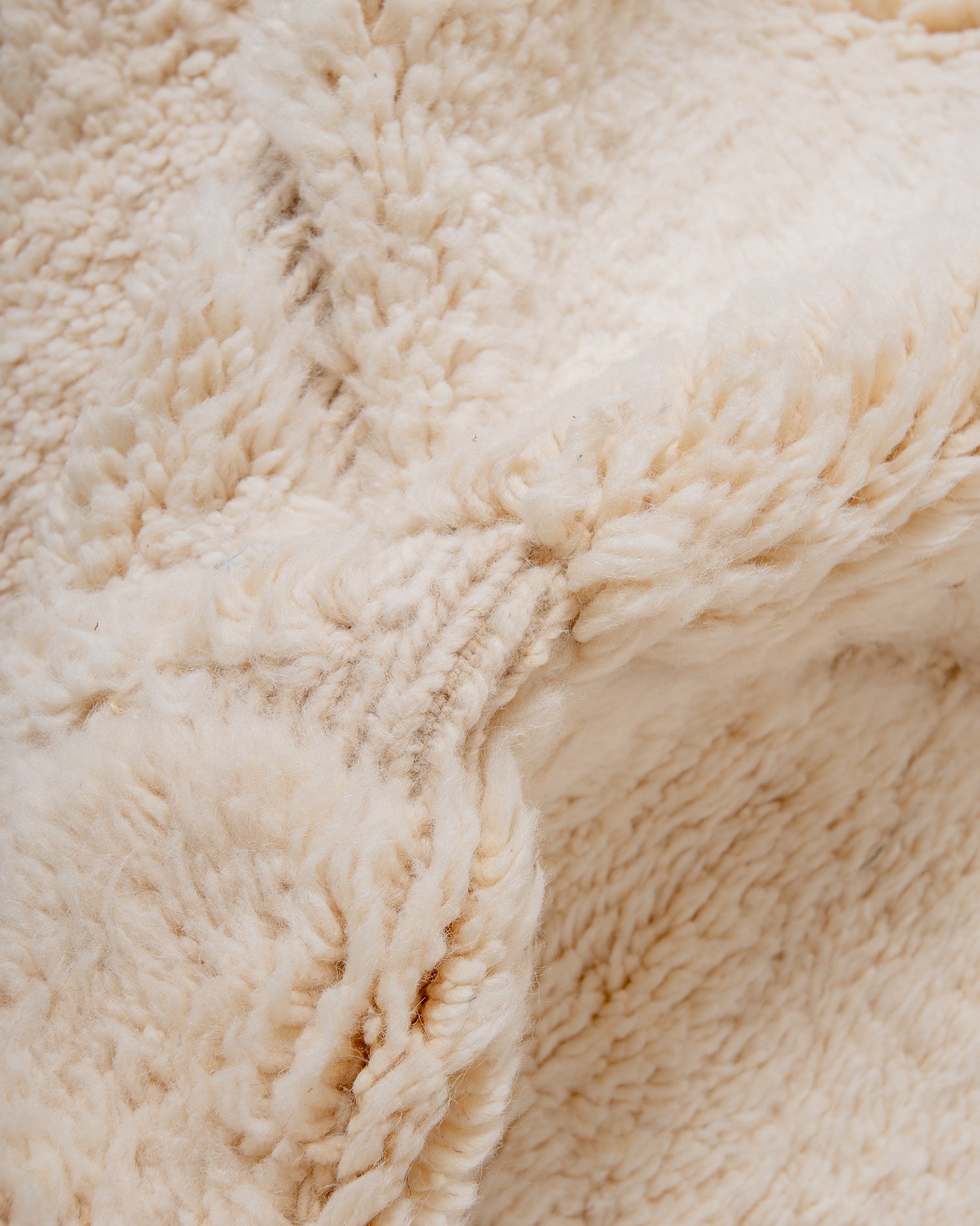 Modern, designer, handcrafted Berber rug from Morocco. Beniourain carpet with minimalist design, natural wool pile and a fluffy texture.