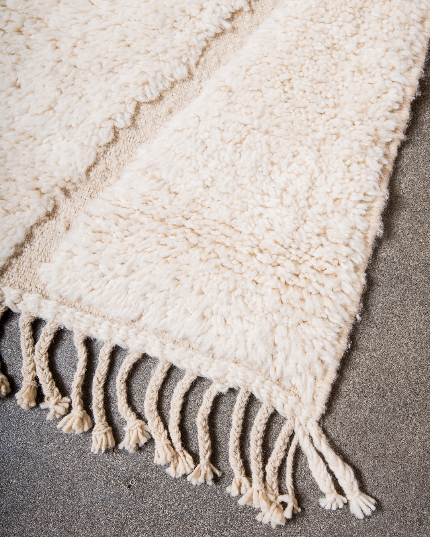 Modern, designer, handcrafted Berber rug from Morocco. Beniourain carpet with minimalist design, natural wool pile and a fluffy texture.
