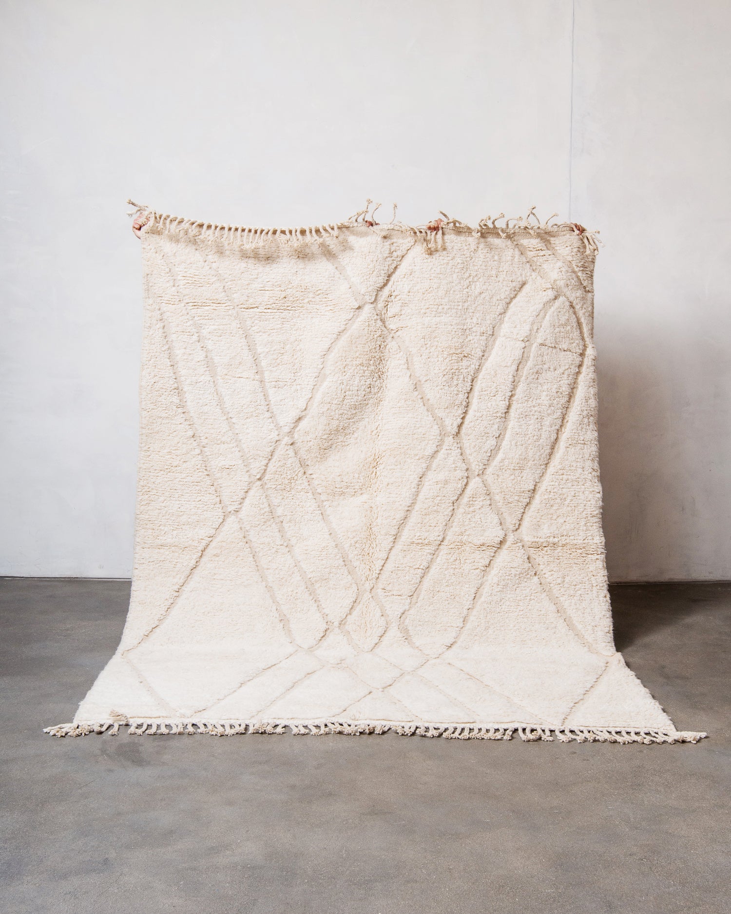 Modern, designer, handcrafted Berber rug from Morocco. Beniourain carpet with minimalist design, natural wool pile and a fluffy texture.