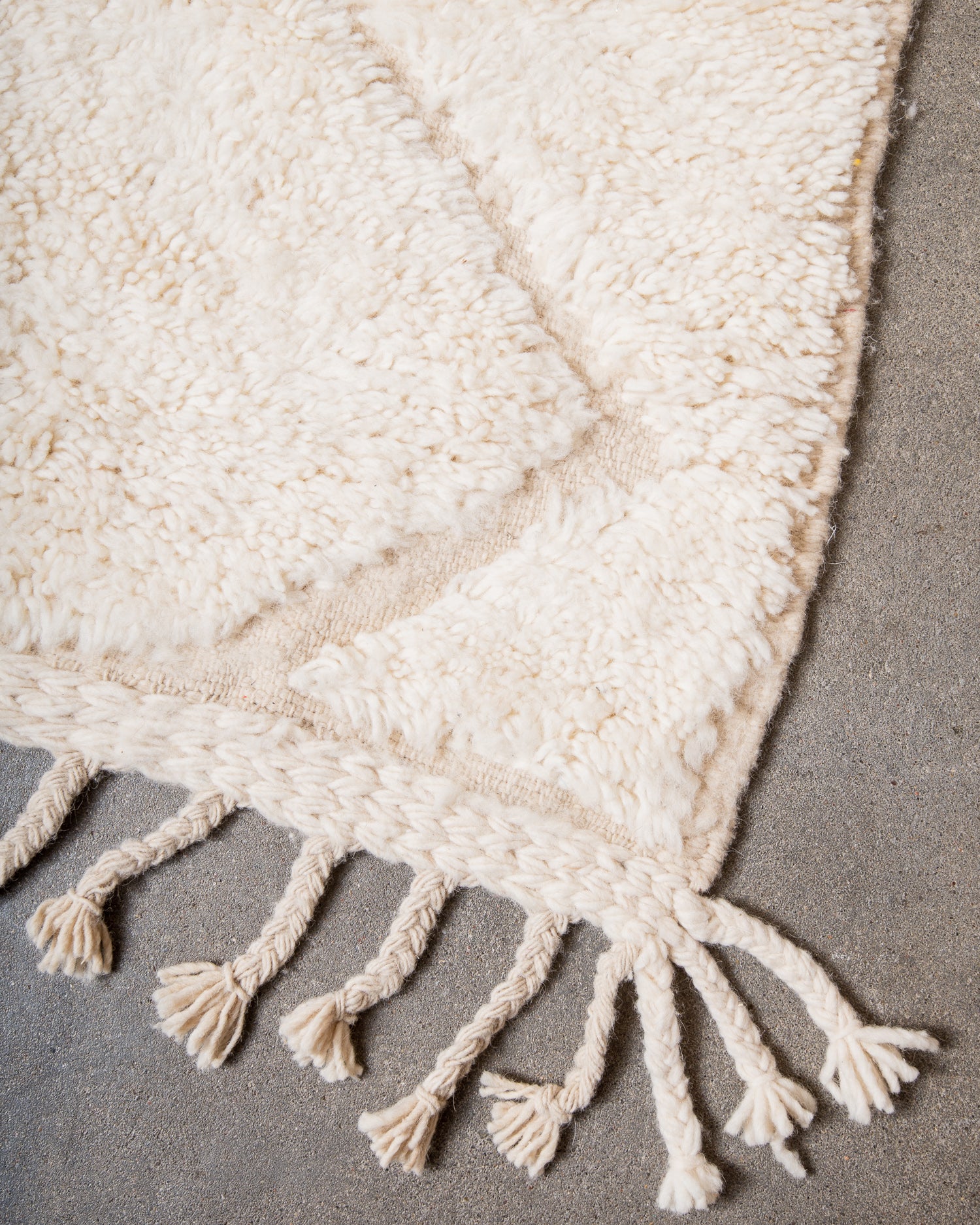 Modern, designer, handcrafted Berber rug from Morocco. Beniourain carpet with minimalist design, natural wool pile and a fluffy texture.