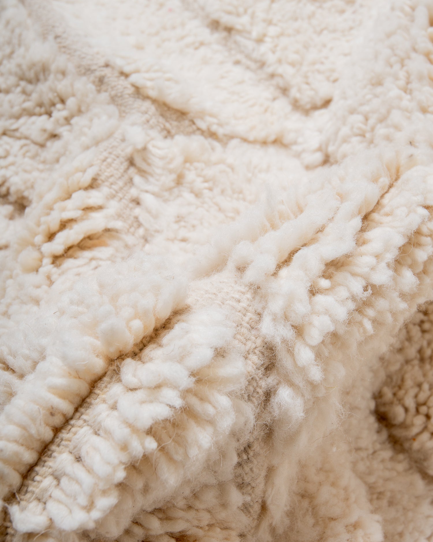 Modern, designer, handcrafted Berber rug from Morocco. Beniourain carpet with minimalist design, natural wool pile and a fluffy texture.