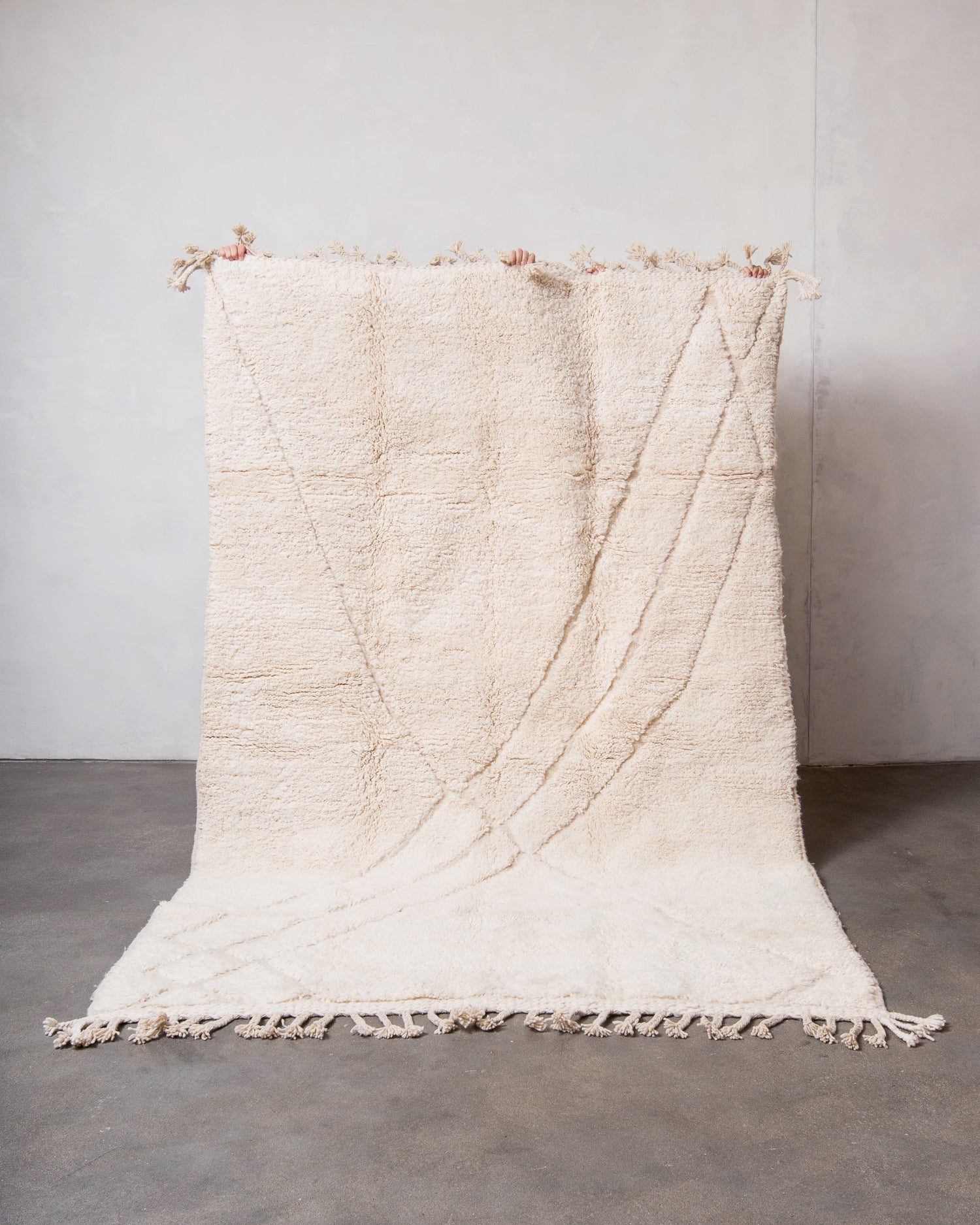 Modern, designer, handcrafted Berber rug from Morocco. Beniourain carpet with minimalist design, natural wool pile and a fluffy texture.