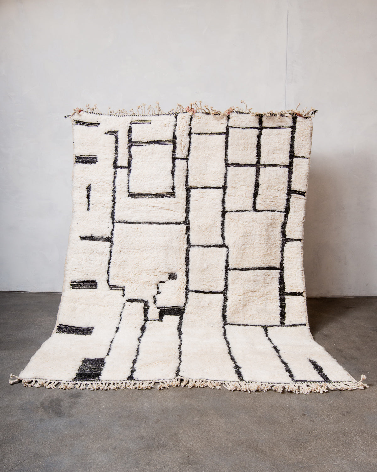 Modern, designer, handcrafted Berber rug from Morocco. Beniourain carpet with beautiful colours and patterns and fluffy wool texture.