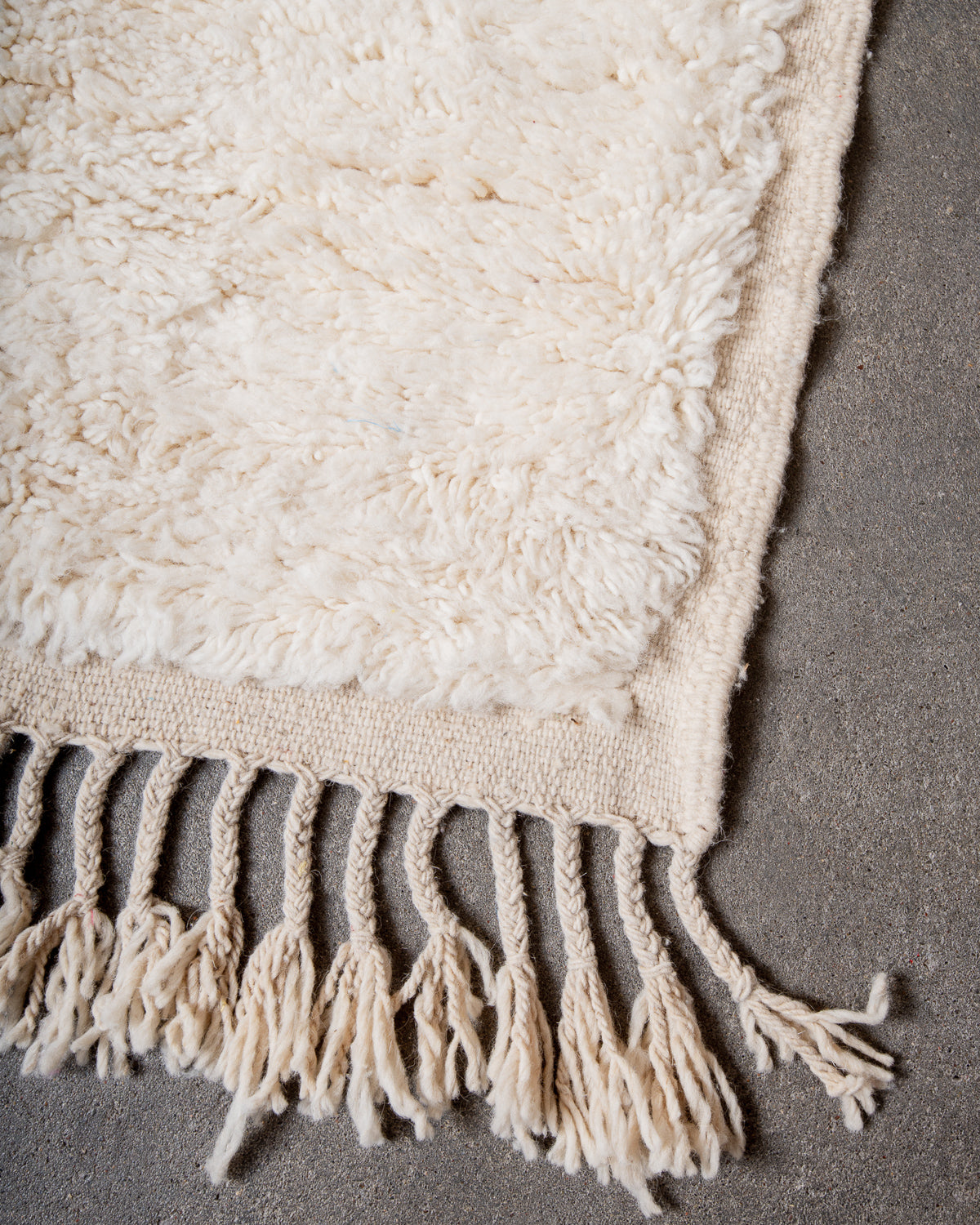 Modern, designer, handcrafted Berber rug from Morocco. Beniourain carpet with minimalist design, natural wool pile and a fluffy texture.