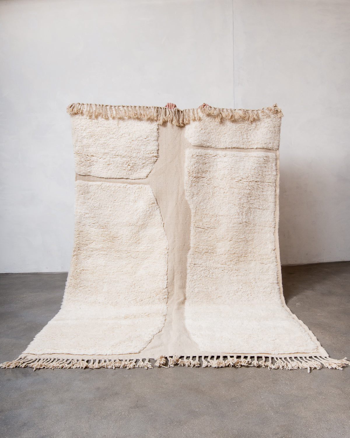 Modern, designer, handcrafted Berber rug from Morocco. Beniourain carpet with minimalist design, natural wool pile and a fluffy texture.