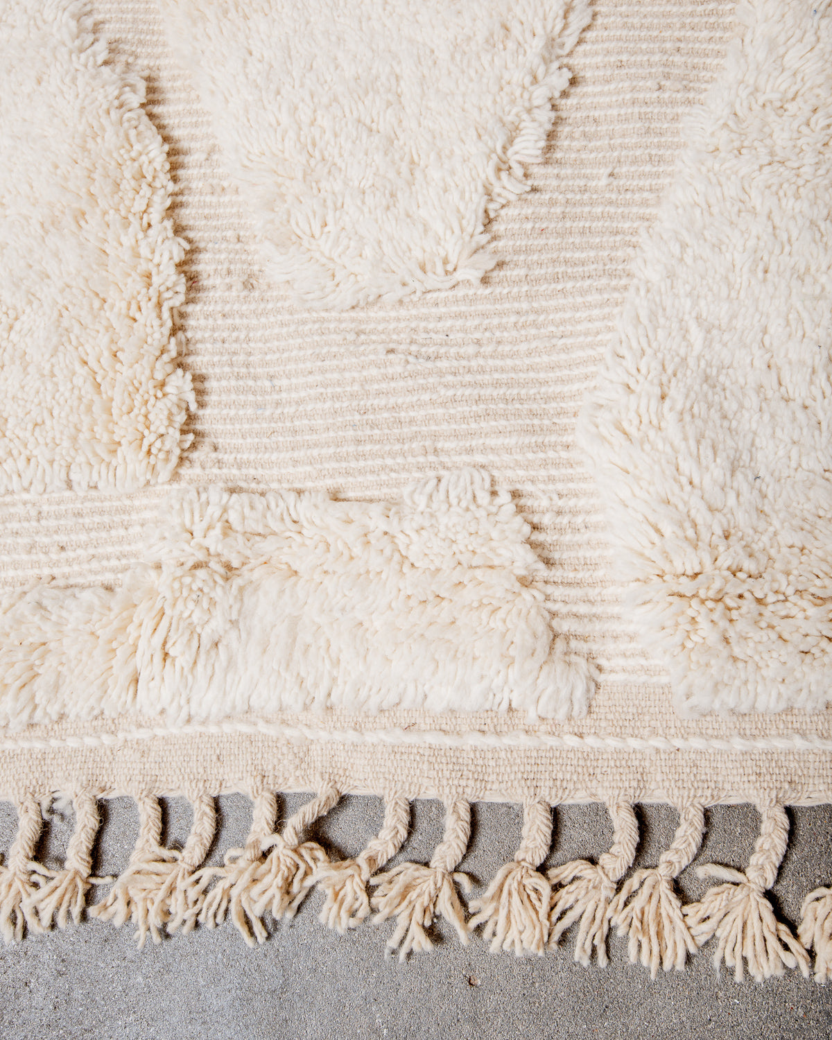 Modern, designer, handcrafted Berber rug from Morocco. Beniourain carpet with minimalist design, natural wool pile and a fluffy texture.