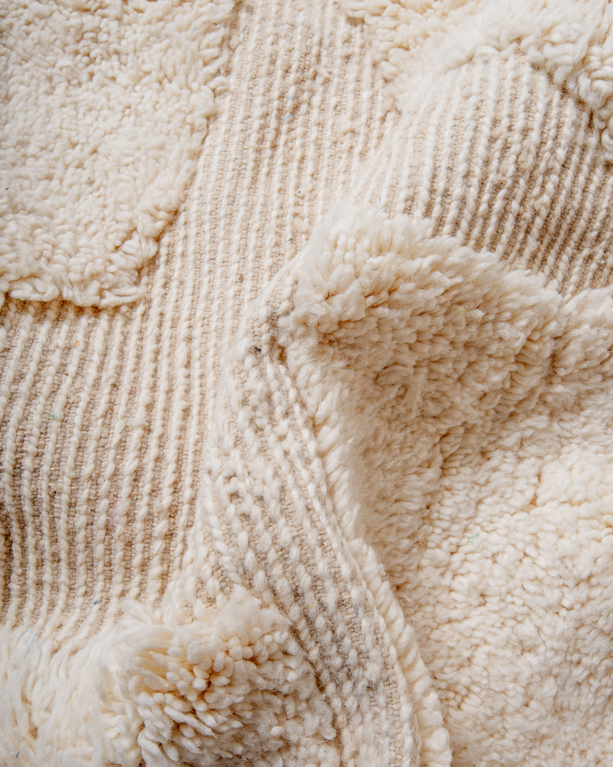 Modern, designer, handcrafted Berber rug from Morocco. Beniourain carpet with minimalist design, natural wool pile and a fluffy texture.