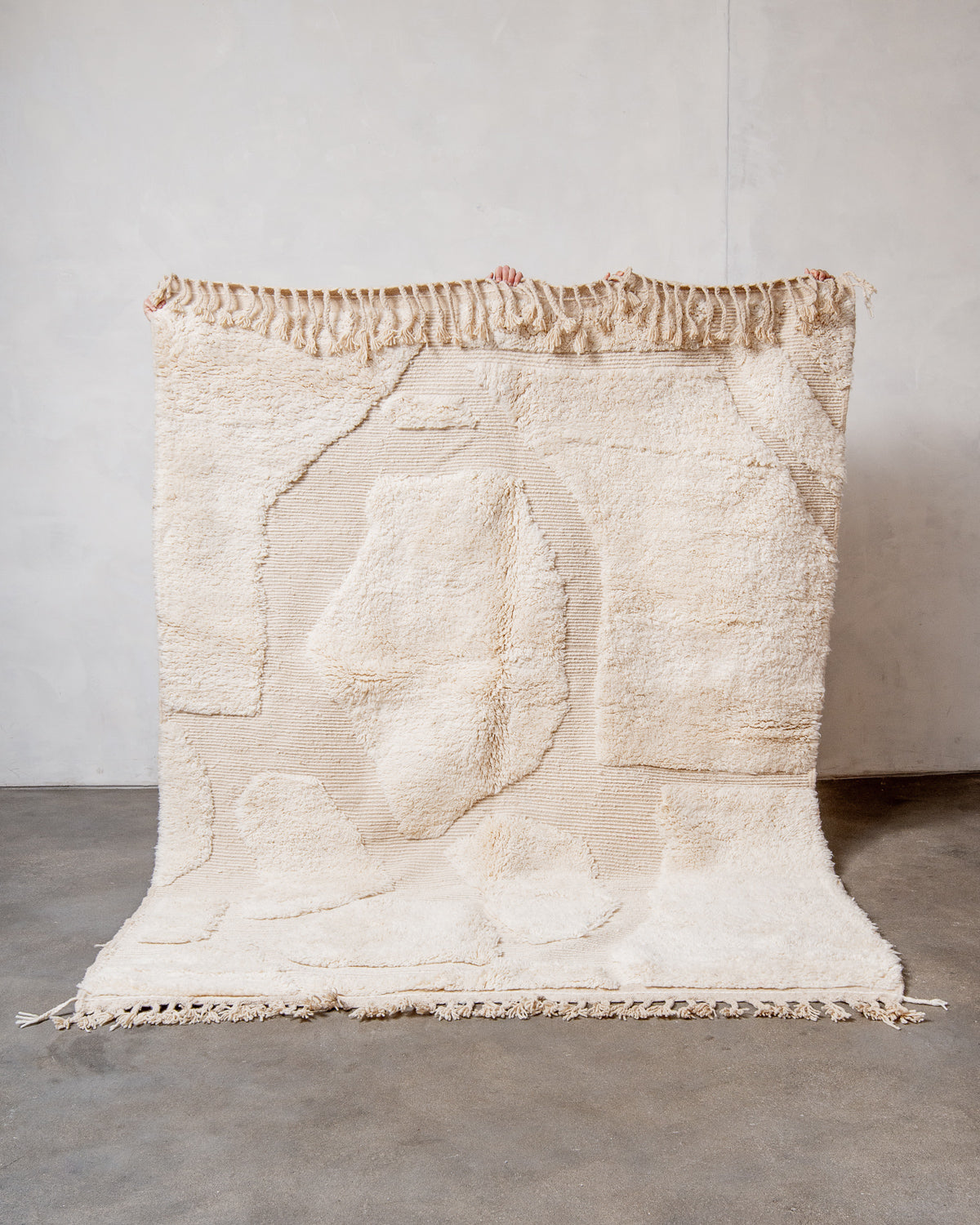 Modern, designer, handcrafted Berber rug from Morocco. Beniourain carpet with minimalist design, natural wool pile and a fluffy texture.