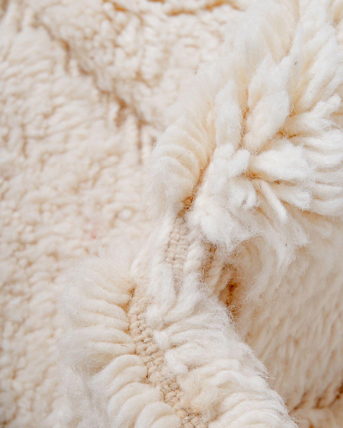 Modern, designer, handcrafted Berber rug from Morocco. Beniourain carpet with minimalist design, natural wool pile and a fluffy texture.