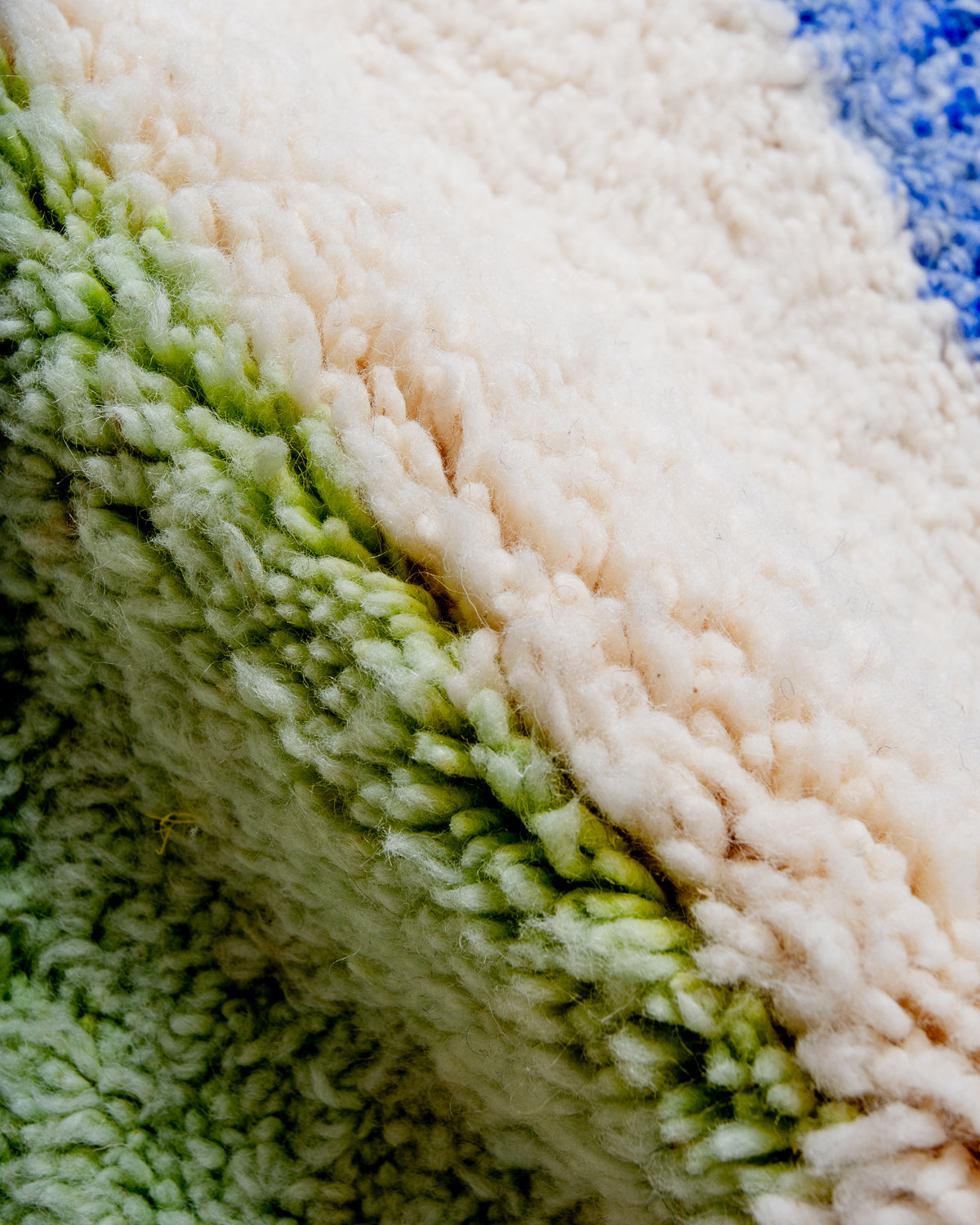 Modern, designer, handcrafted Berber rug from Morocco. Beniourain carpet with beautiful colours and patterns and fluffy wool texture.