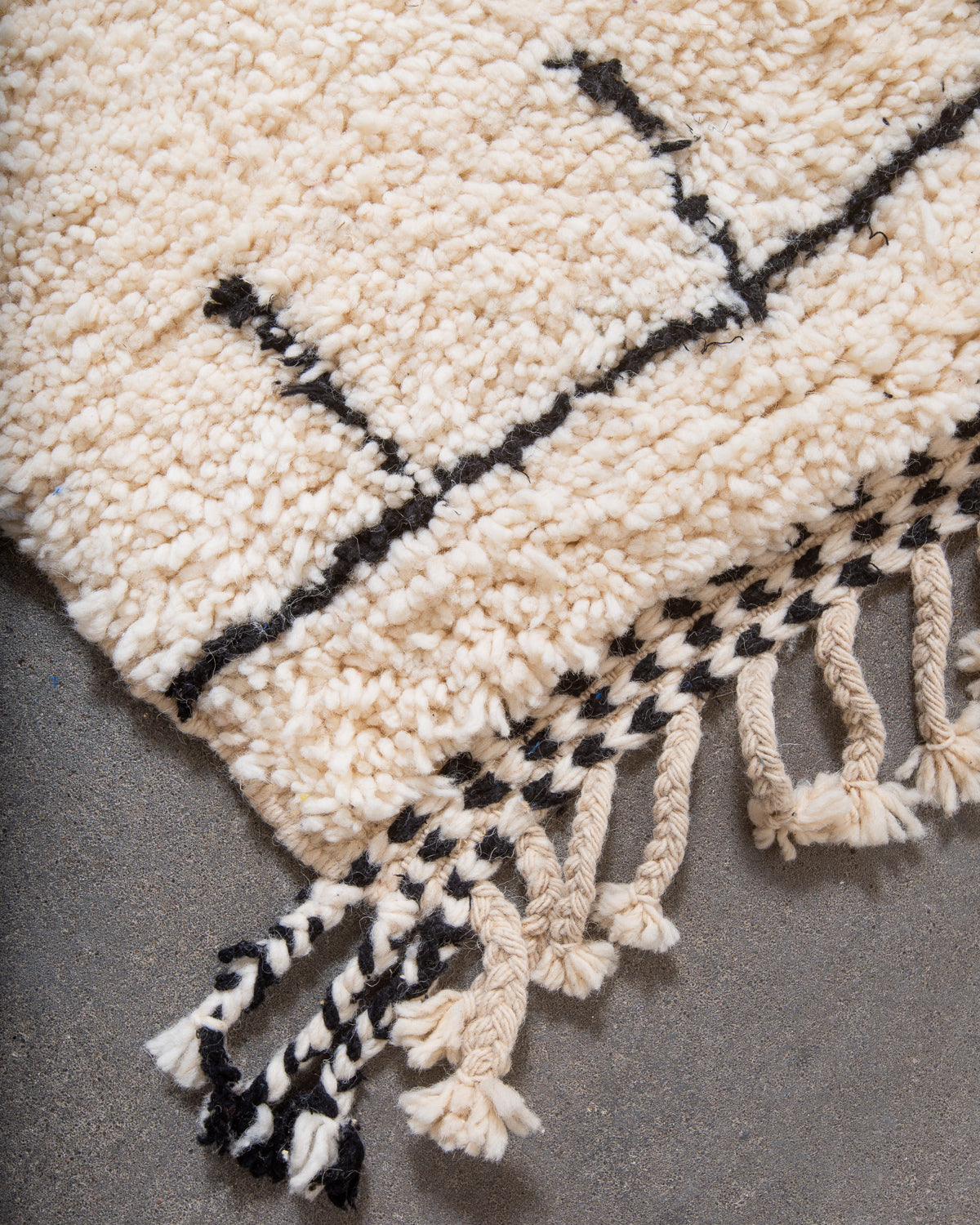 Modern, designer, handcrafted Berber rug from Morocco. Beniourain carpet with minimalist design, natural wool pile and a fluffy texture.