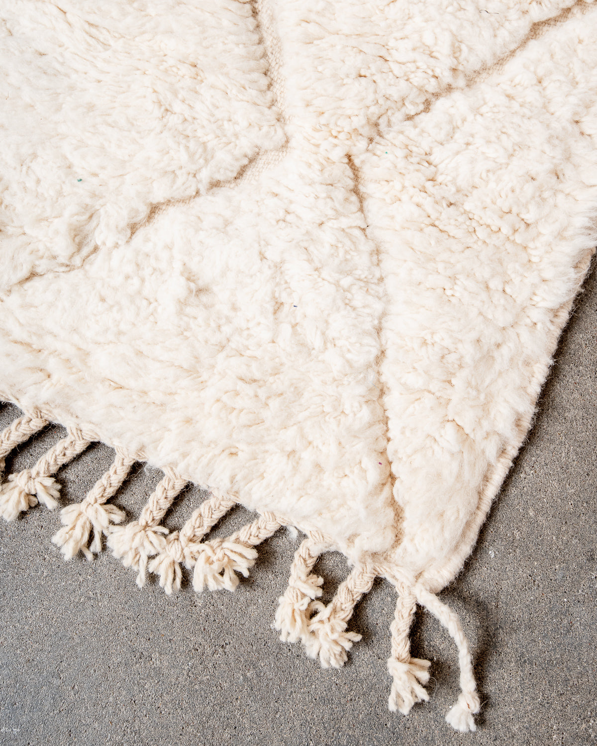 Modern, designer, handcrafted Berber rug from Morocco. Beniourain carpet with minimalist design, natural wool pile and a fluffy texture.
