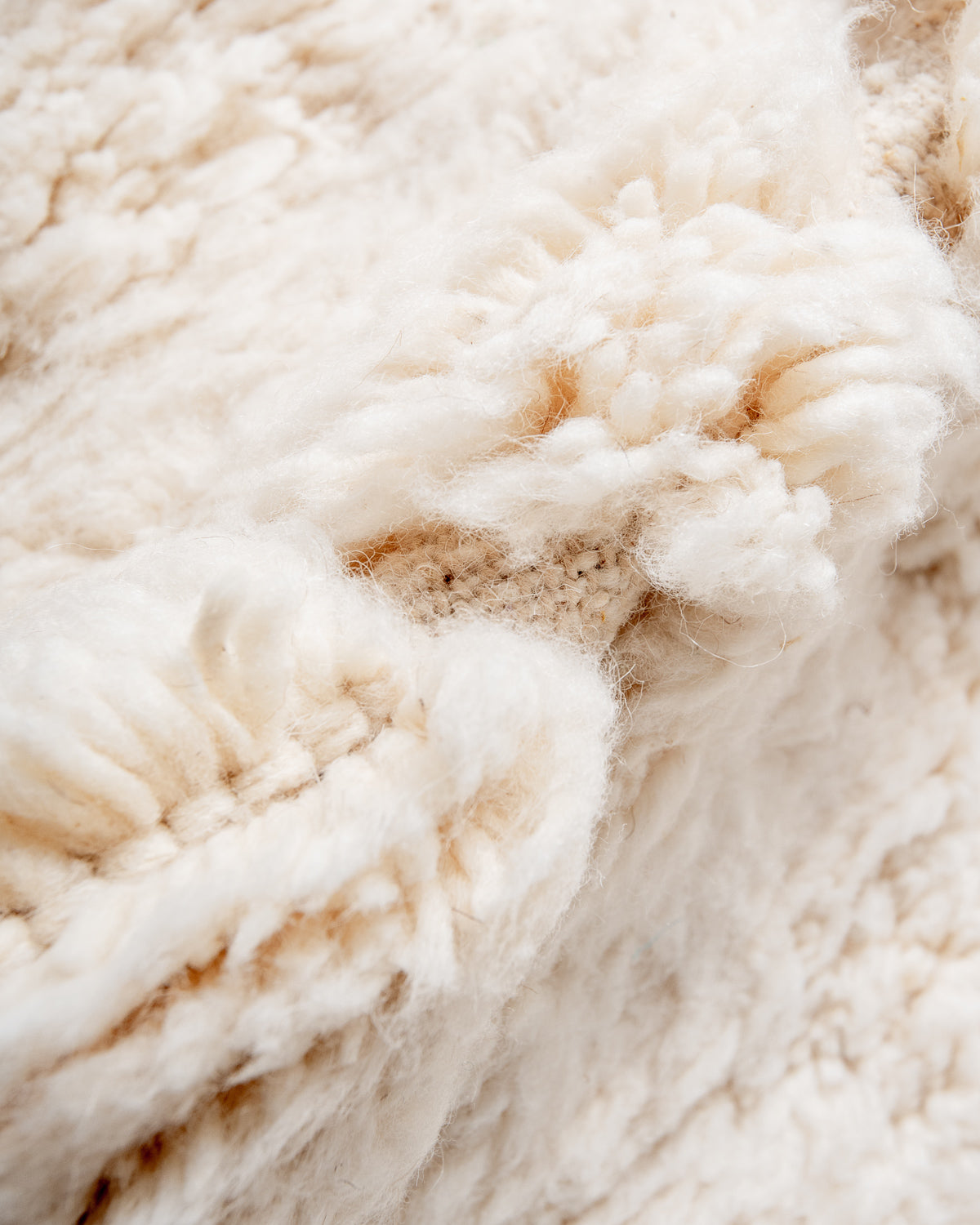 Modern, designer, handcrafted Berber rug from Morocco. Beniourain carpet with minimalist design, natural wool pile and a fluffy texture.