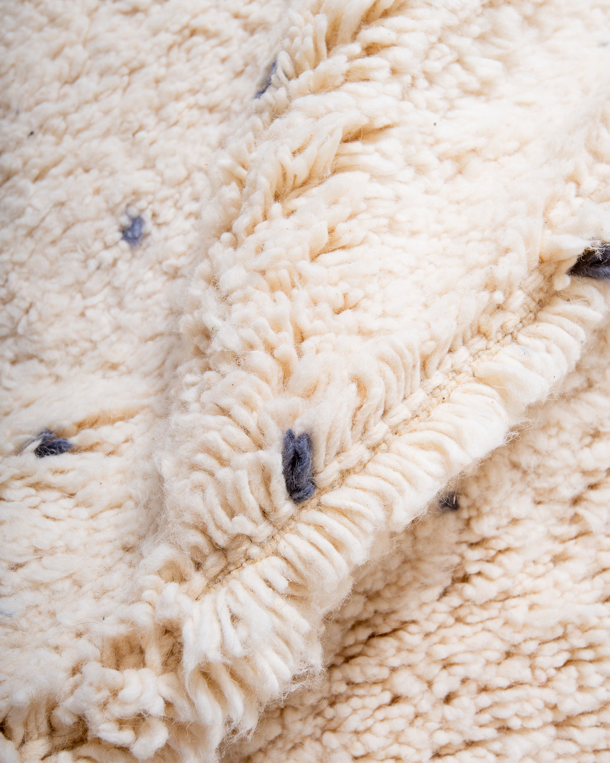 Modern, designer, handcrafted Berber rug from Morocco. Beniourain carpet with minimalist design, natural wool pile and a fluffy texture.