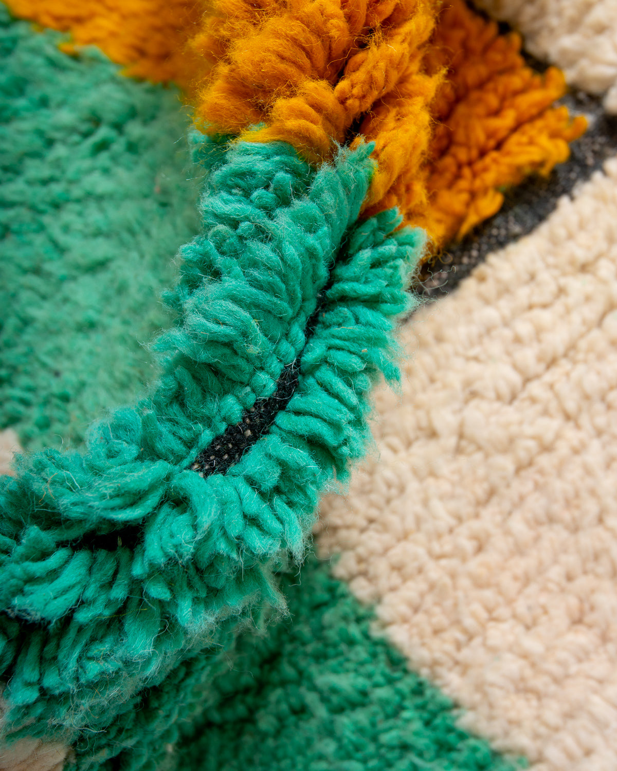 Modern, designer, handcrafted Berber rug from Morocco. Beniourain carpet with beautiful colours and patterns and fluffy wool texture.