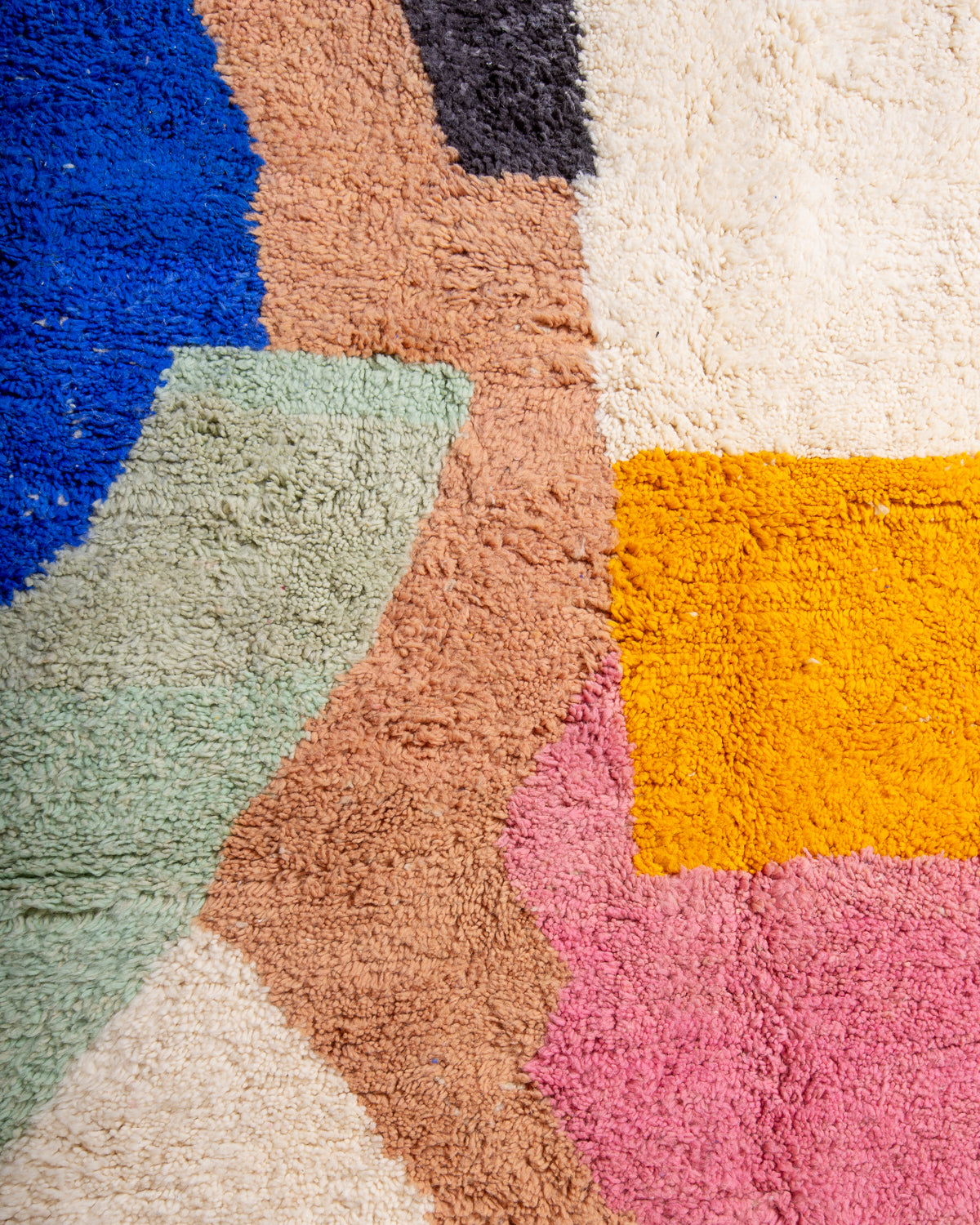 Modern, designer, handcrafted Berber rug from Morocco. Beniourain carpet with beautiful colours and patterns and fluffy wool texture.