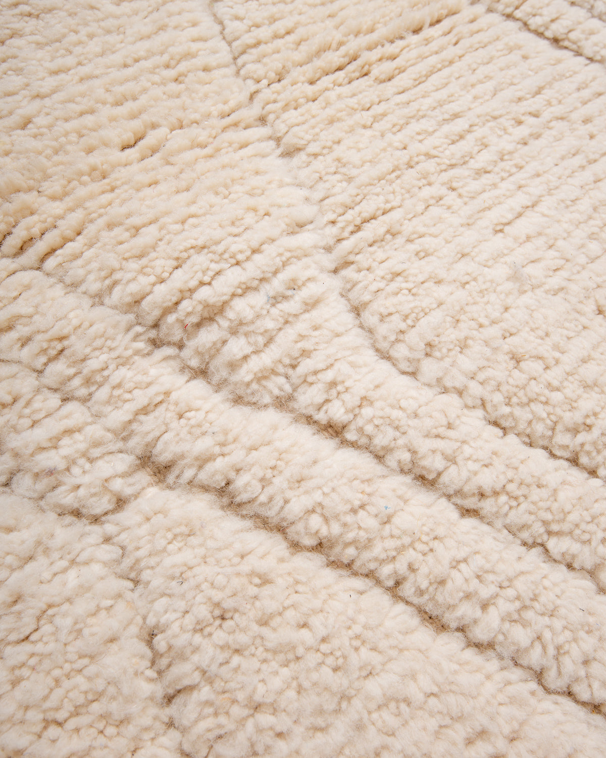 Modern, designer, handcrafted Berber rug from Morocco. Beniourain carpet with minimalist design, natural wool pile and a fluffy texture.