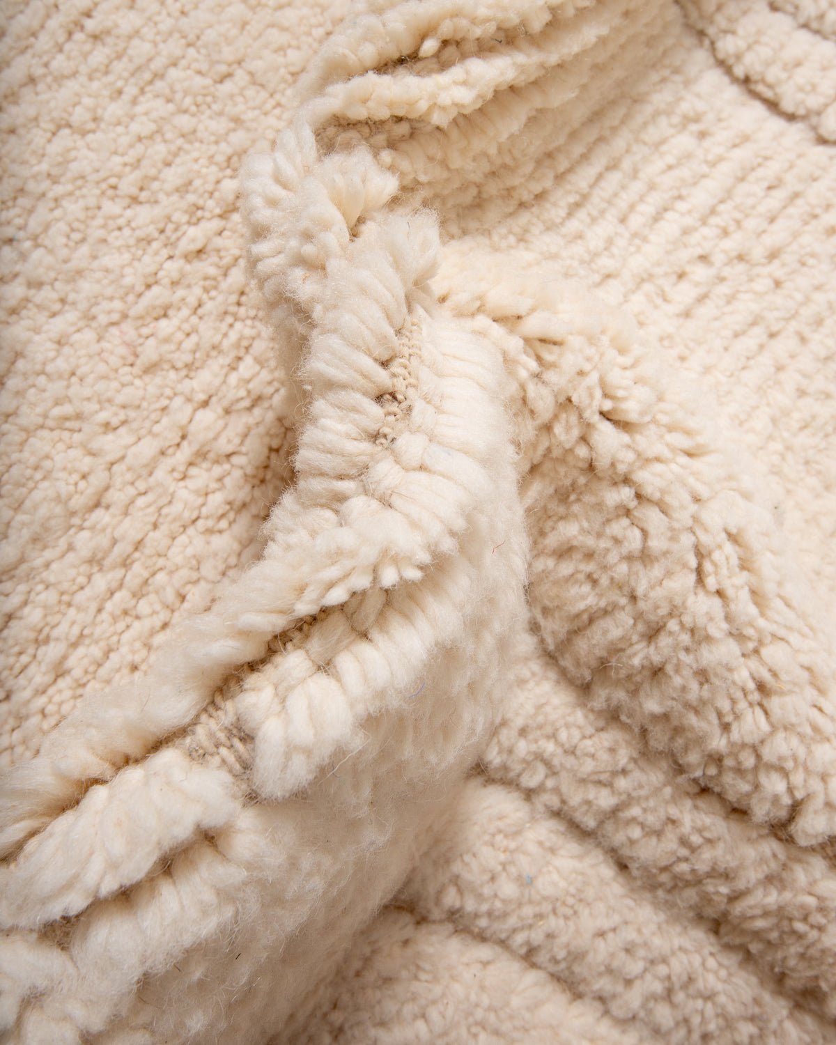 Modern, designer, handcrafted Berber rug from Morocco. Beniourain carpet with minimalist design, natural wool pile and a fluffy texture.