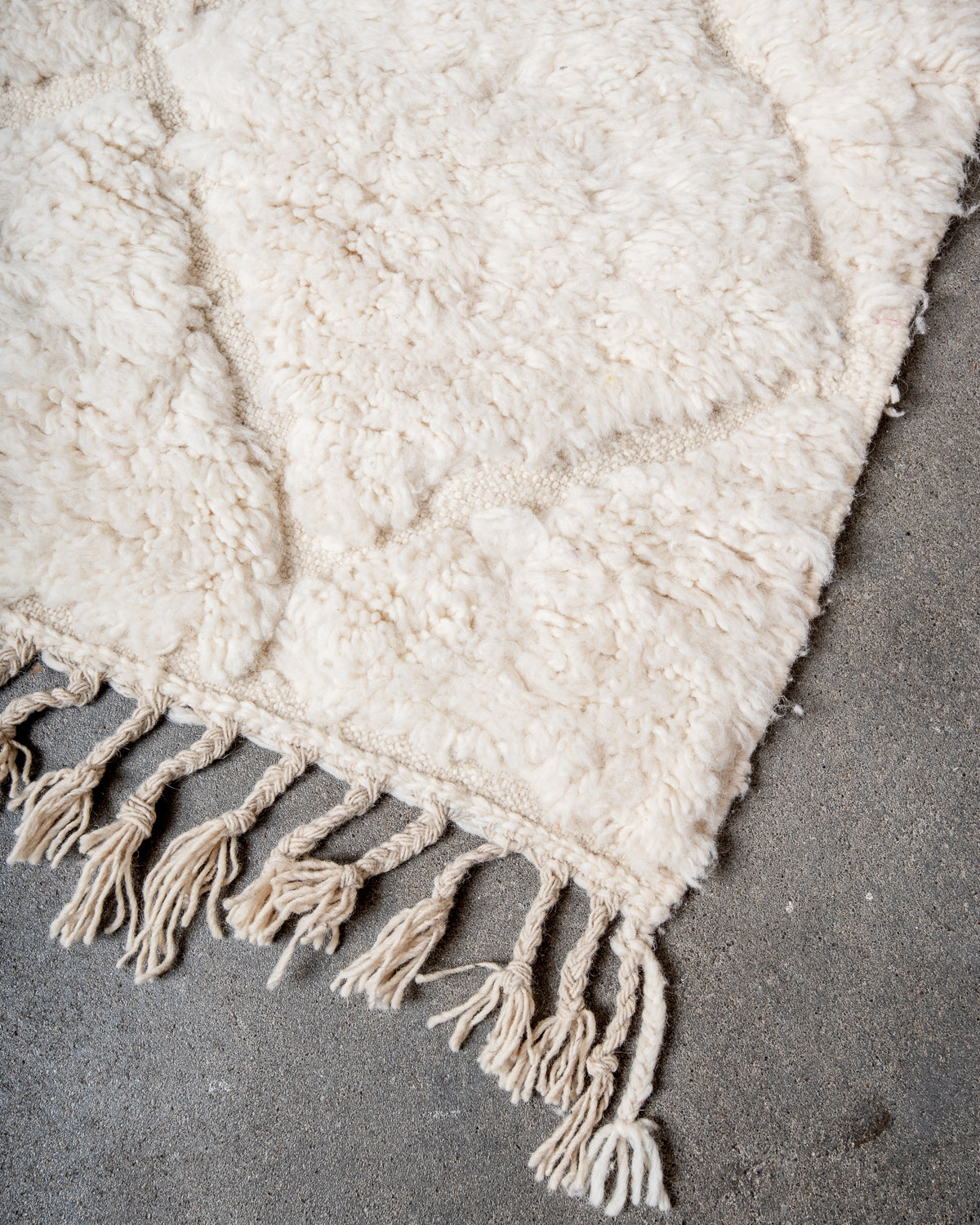Modern, designer, handcrafted Berber rug from Morocco. Beniourain carpet with minimalist design, natural wool pile and a fluffy texture.