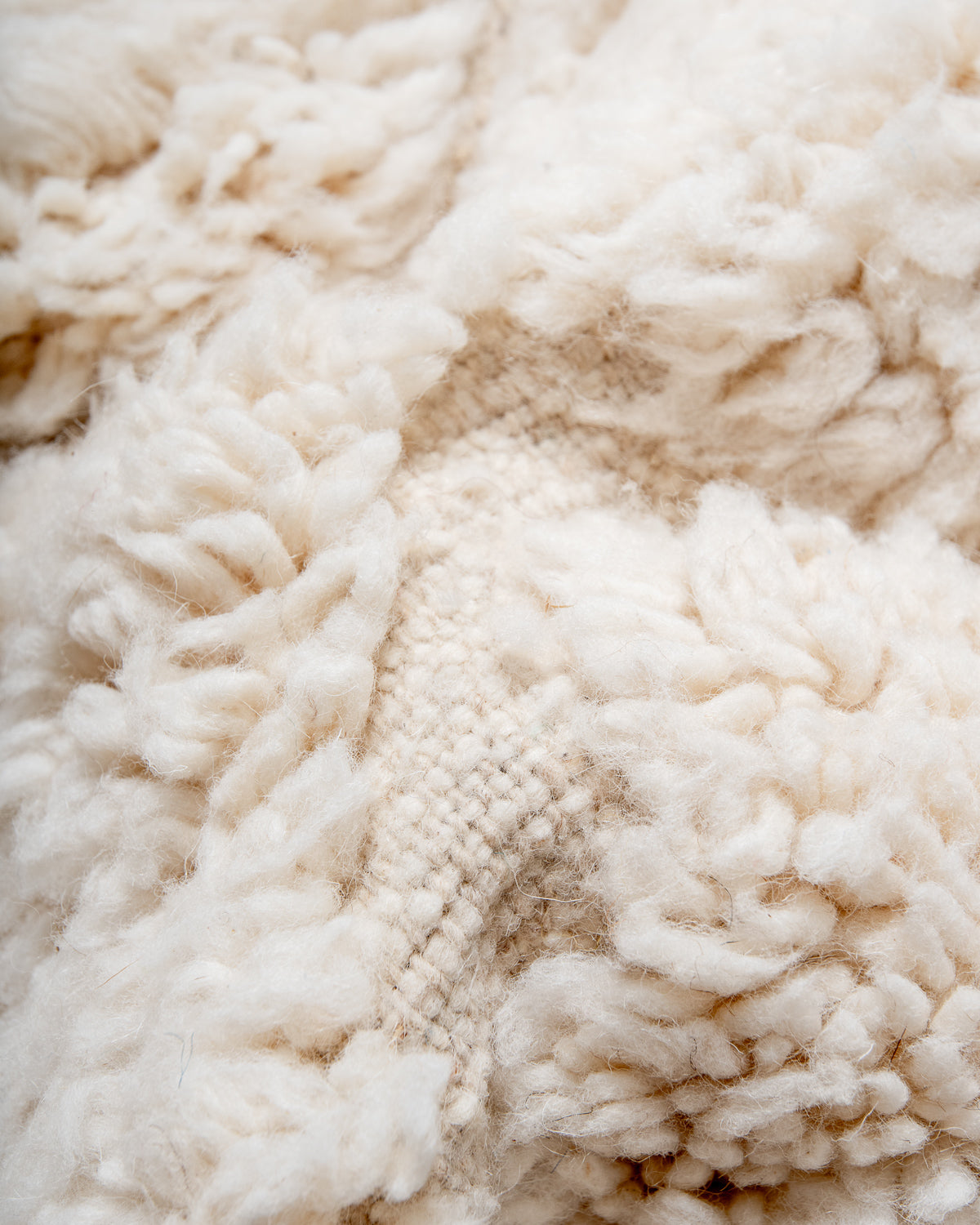 Modern, designer, handcrafted Berber rug from Morocco. Beniourain carpet with minimalist design, natural wool pile and a fluffy texture.