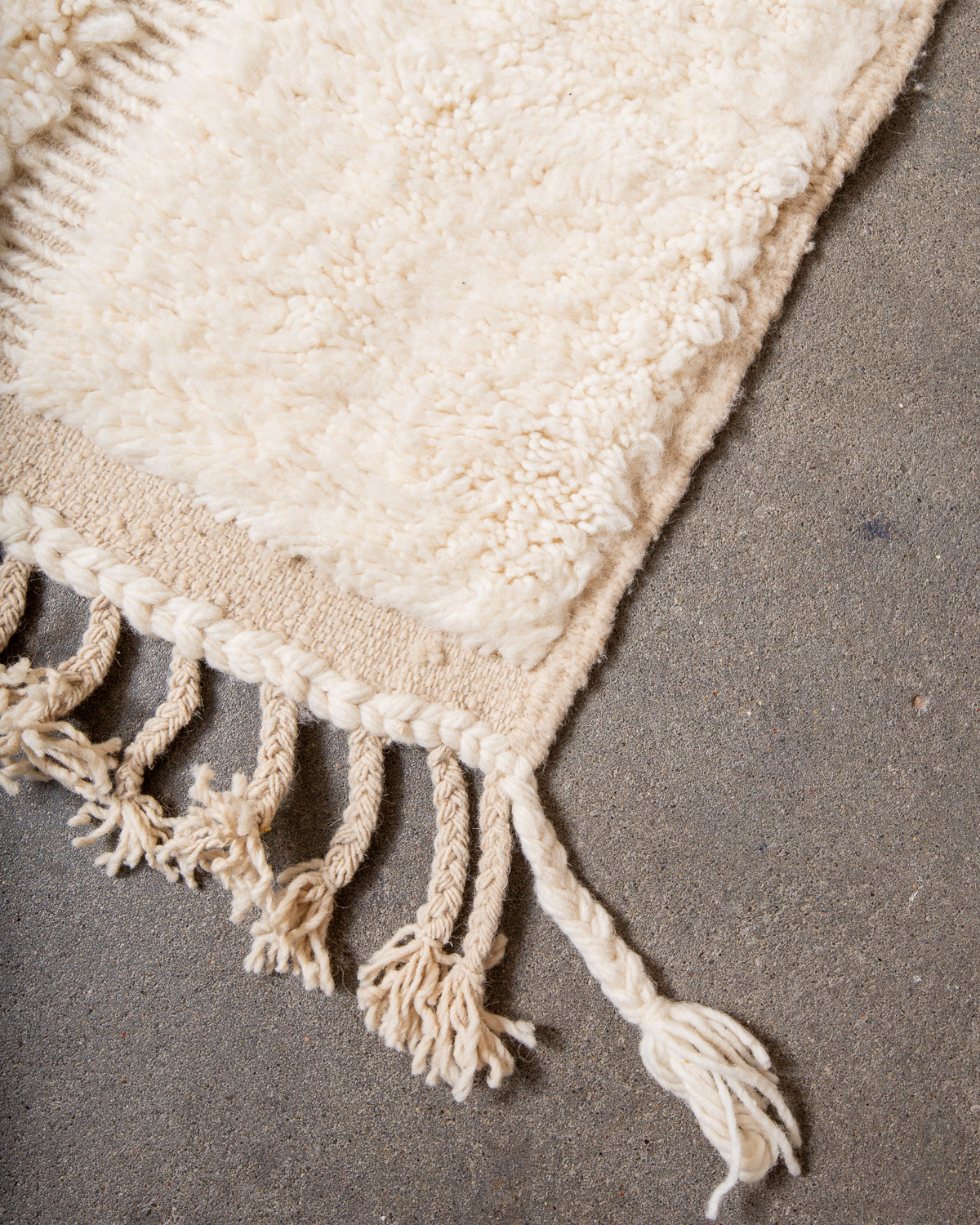 Modern, designer, handcrafted Berber rug from Morocco. Beniourain carpet with minimalist design, natural wool pile and a fluffy texture.