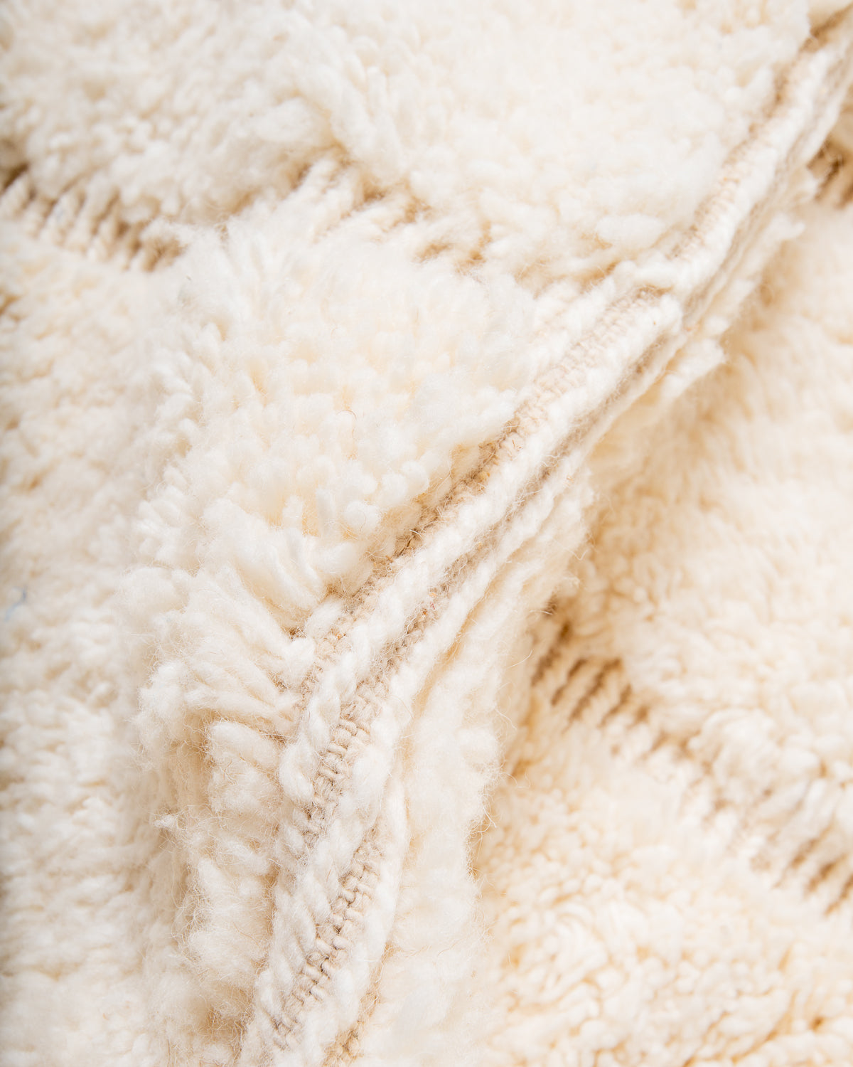 Modern, designer, handcrafted Berber rug from Morocco. Beniourain carpet with minimalist design, natural wool pile and a fluffy texture.