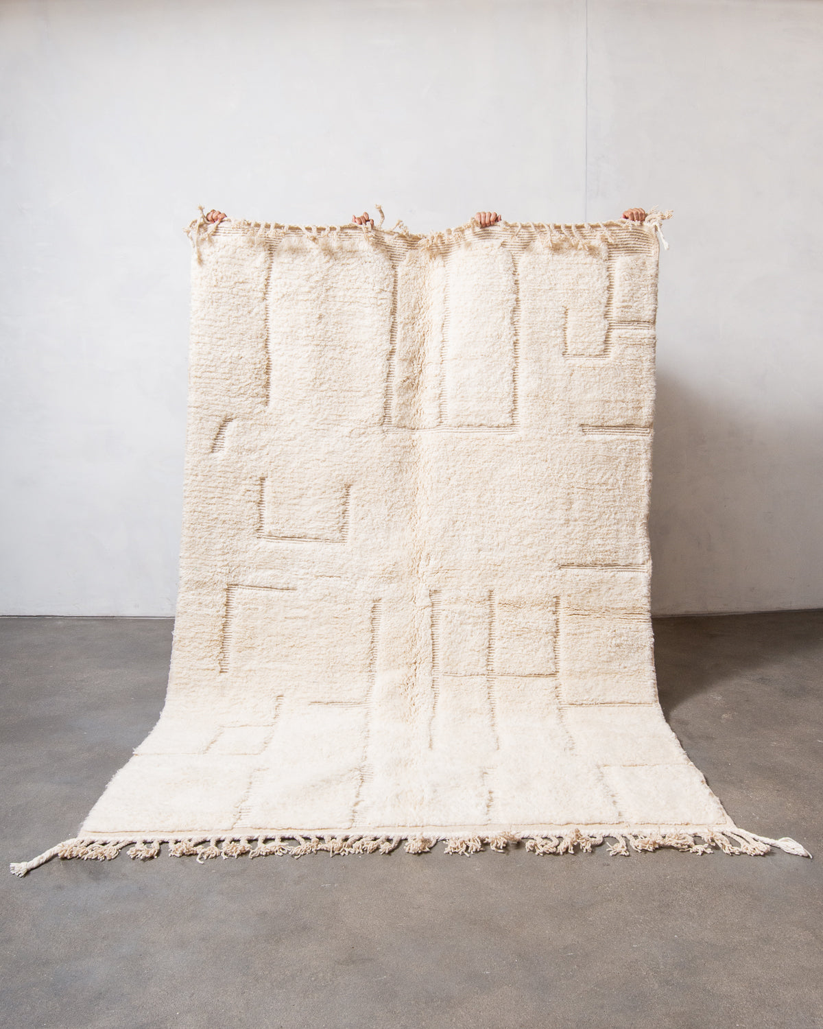 Modern, designer, handcrafted Berber rug from Morocco. Beniourain carpet with minimalist design, natural wool pile and a fluffy texture.