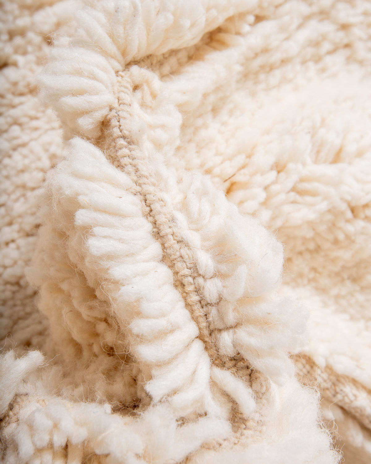 Modern, designer, handcrafted Berber rug from Morocco. Beniourain carpet with minimalist design, natural wool pile and a fluffy texture.