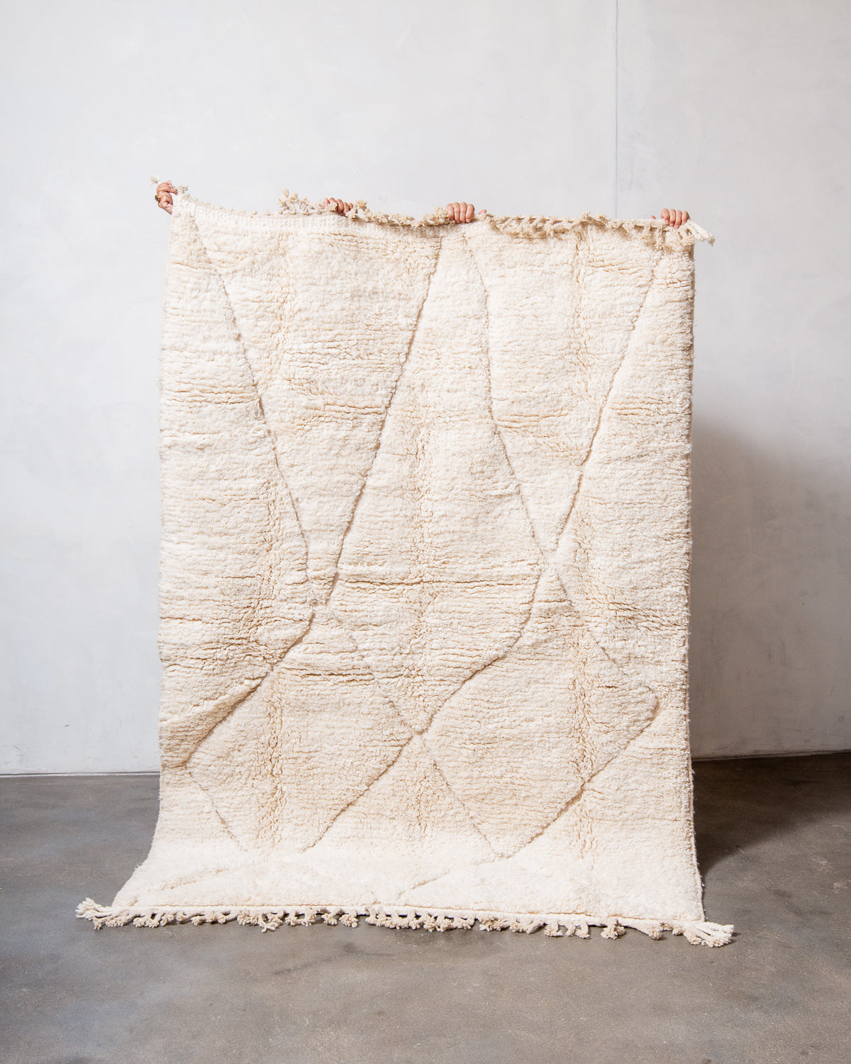 Modern, designer, handcrafted Berber rug from Morocco. Beniourain carpet with minimalist design, natural wool pile and a fluffy texture.