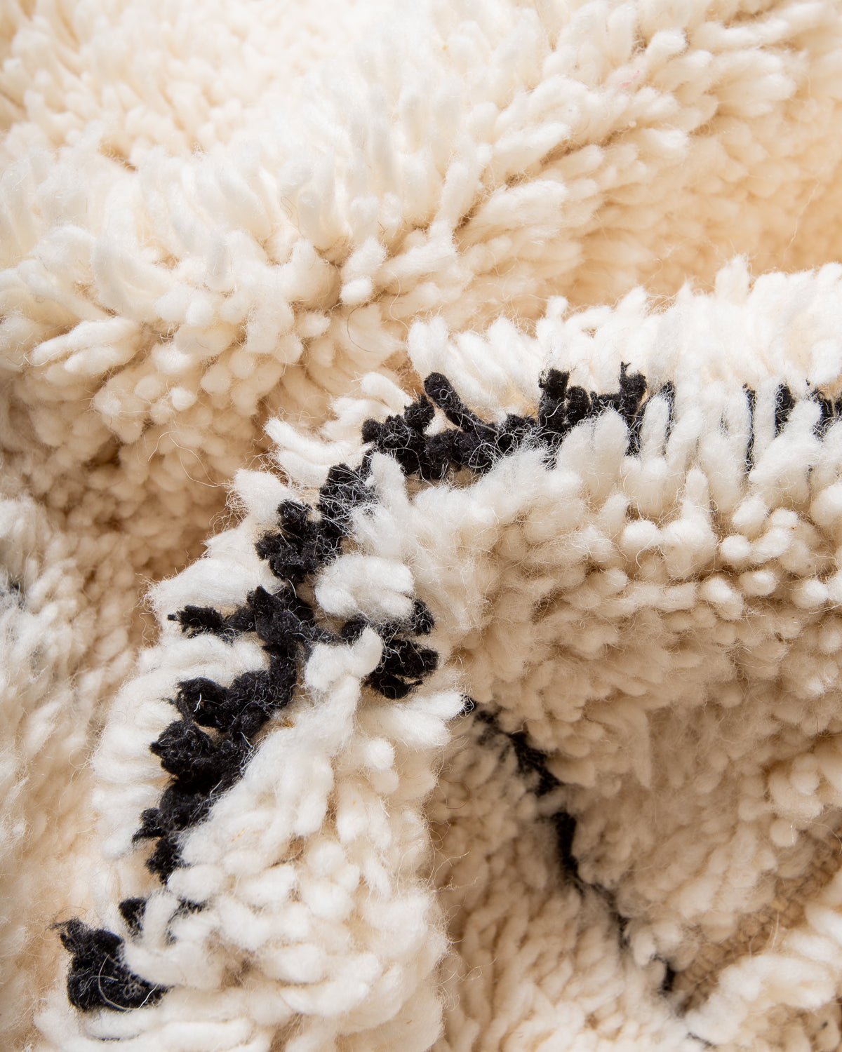 Modern, designer, handcrafted Berber rug from Morocco. Beniourain carpet with minimalist design, natural wool pile and a fluffy texture.