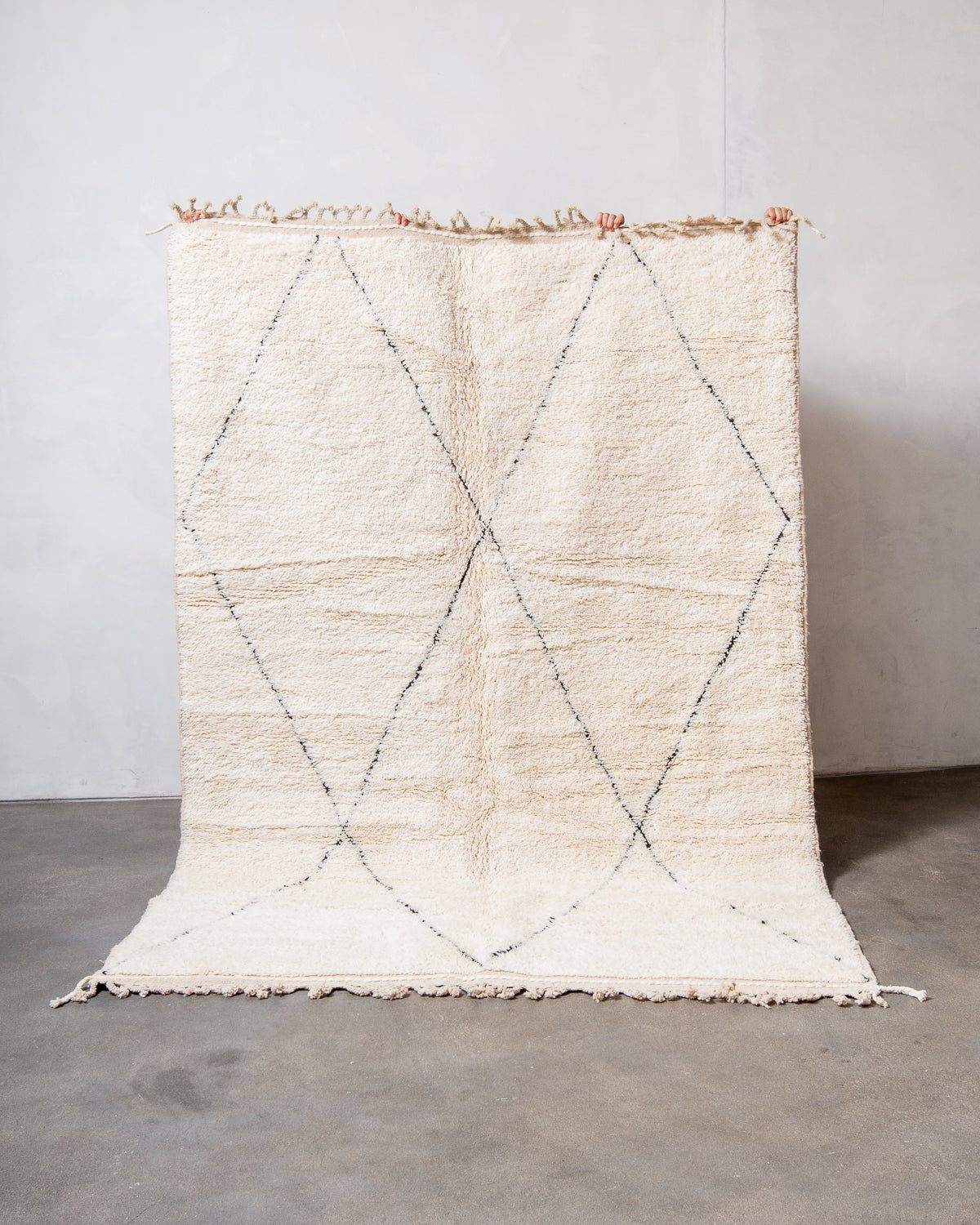 Modern, designer, handcrafted Berber rug from Morocco. Beniourain carpet with minimalist design, natural wool pile and a fluffy texture.