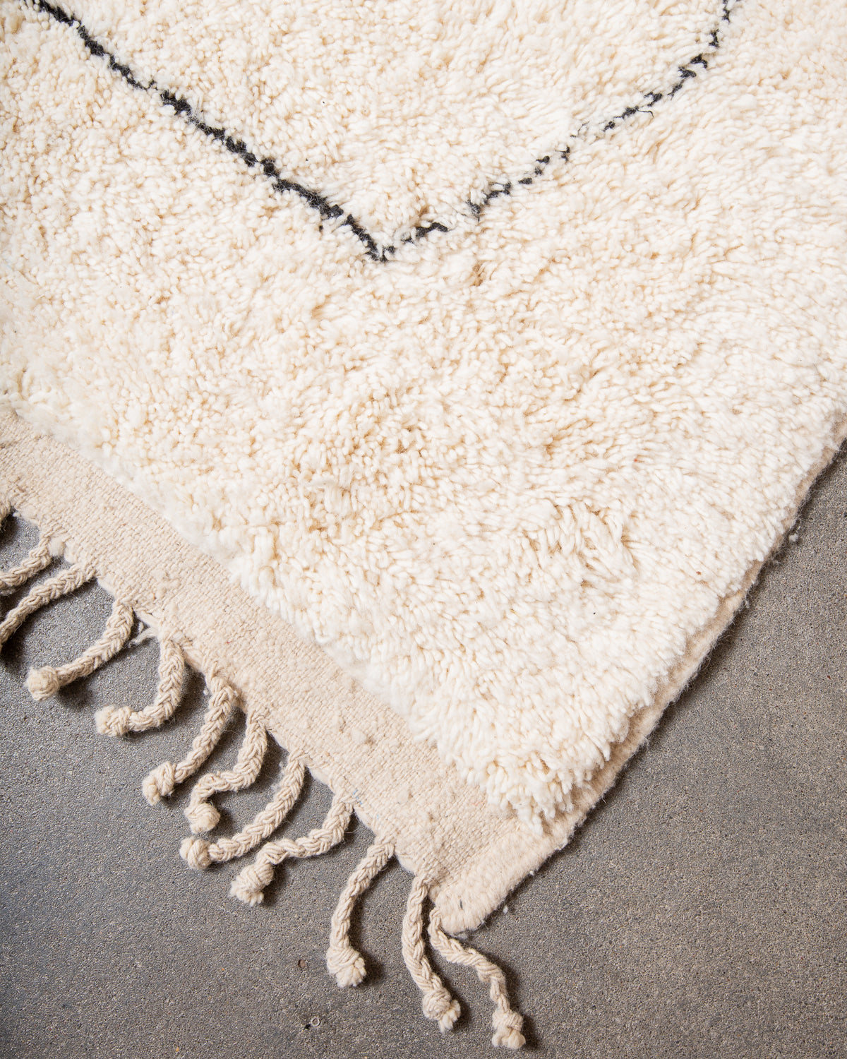 Modern, designer, handcrafted Berber rug from Morocco. Beniourain carpet with minimalist design, natural wool pile and a fluffy texture.