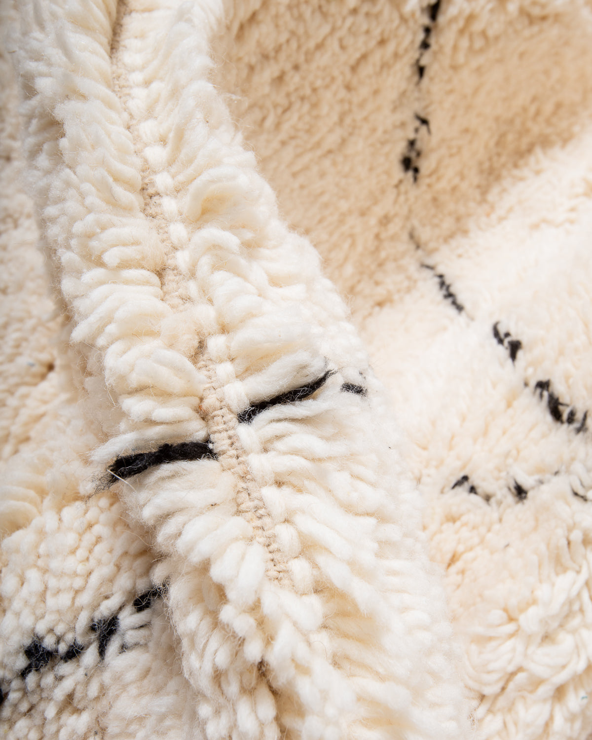 Modern, designer, handcrafted Berber rug from Morocco. Beniourain carpet with minimalist design, natural wool pile and a fluffy texture.