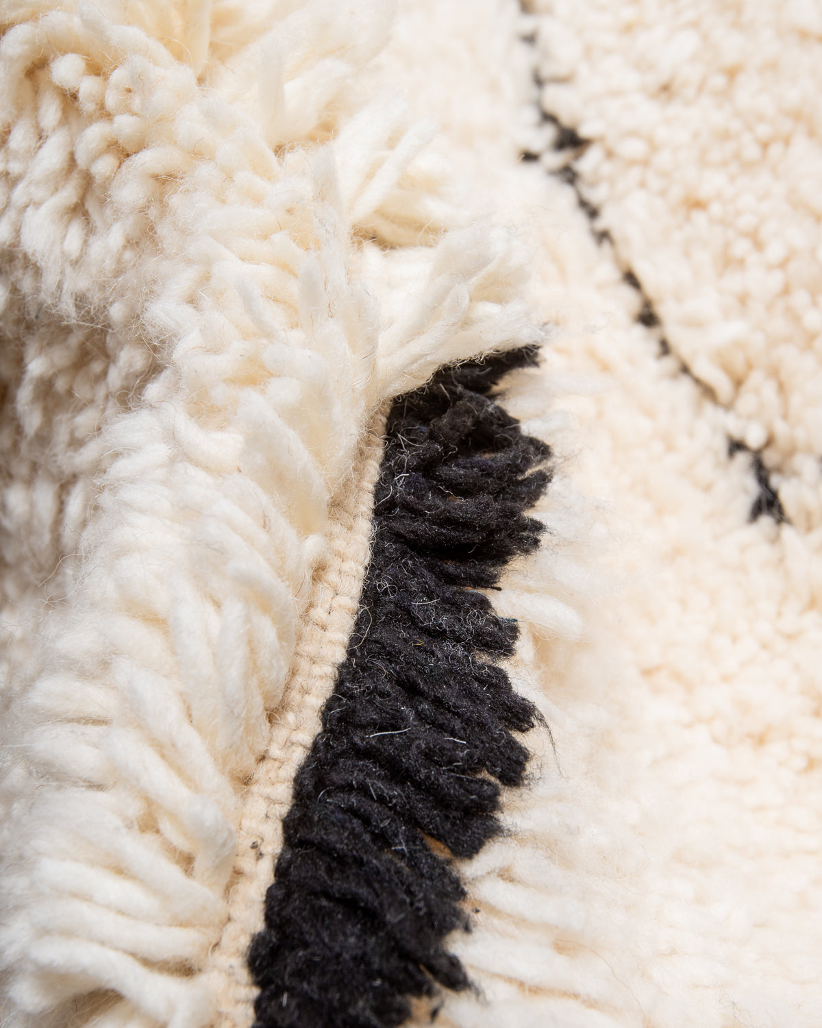 Modern, designer, handcrafted Berber rug from Morocco. Beniourain carpet with minimalist design, natural wool pile and a fluffy texture.